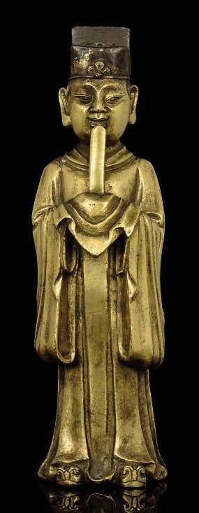 A GILT BRONZE MODEL OF A STANDING OFFICIAL