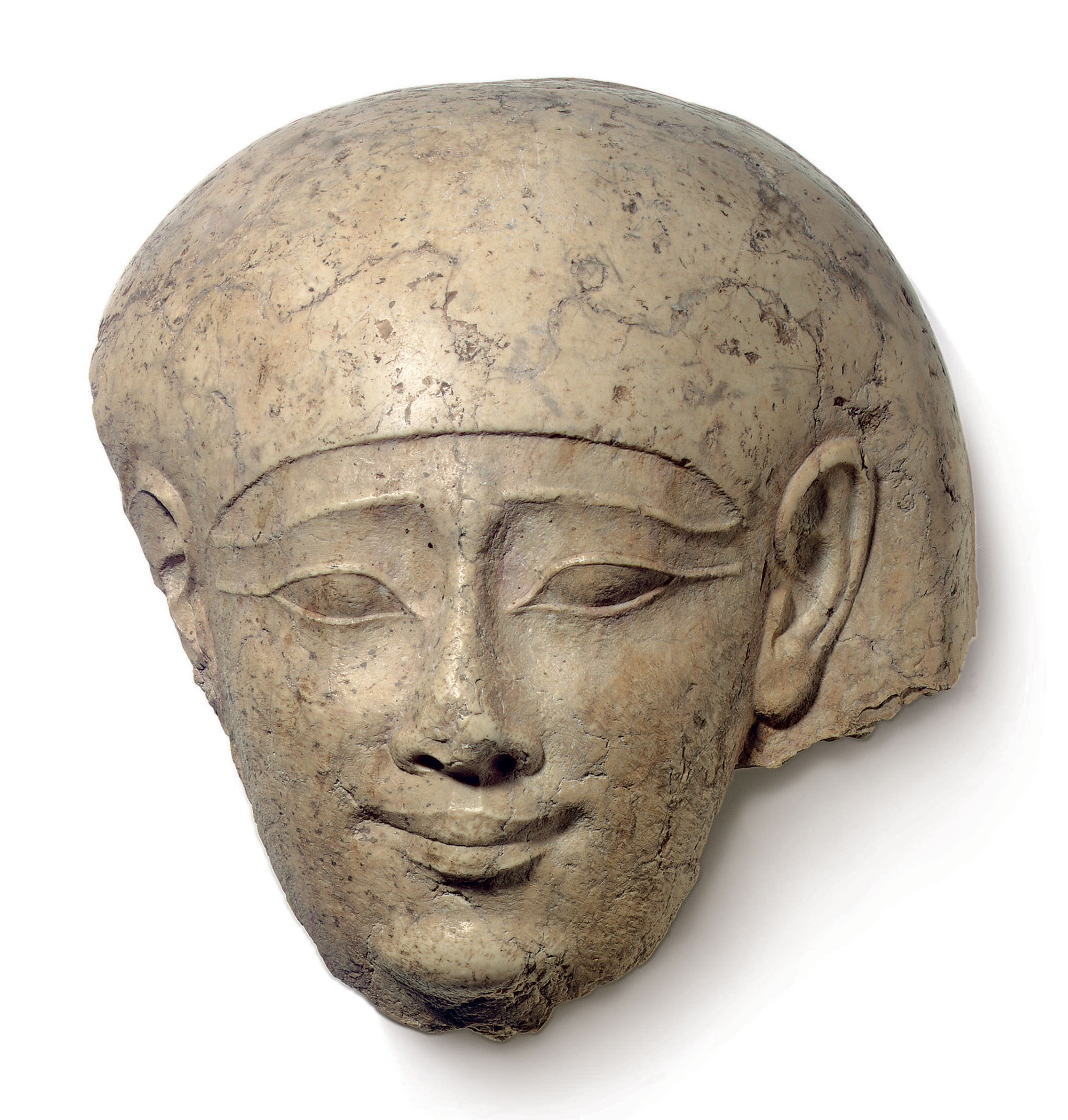 AN EGYPTIAN LIMESTONE HEAD FROM A SARCOPHAGUS LID