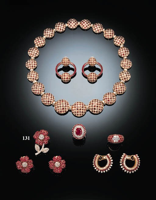 A DELICATE RUBY AND DIAMOND FLOWER BROOCH