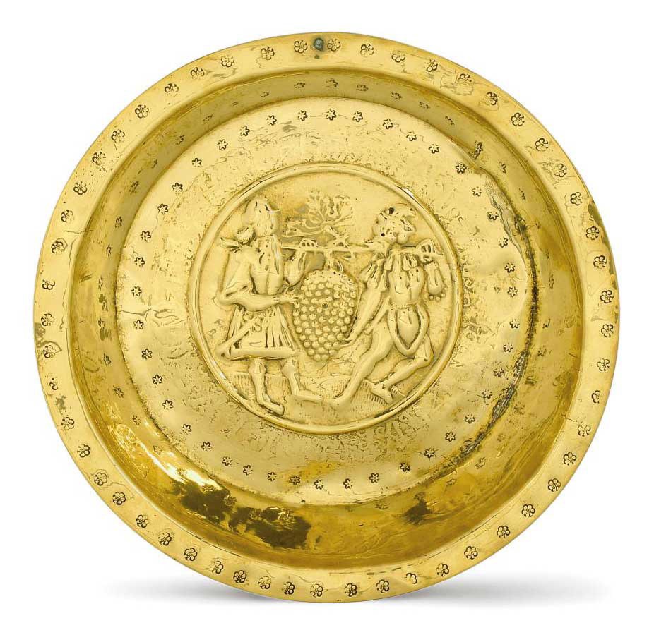 A NUREMBERG BRASS DEEP-SIDED ALMS BASIN