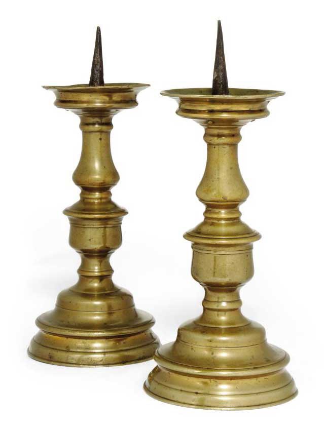 A PAIR OF FLEMISH OR GERMAN BRASS PRICKET CANDLESTICKS