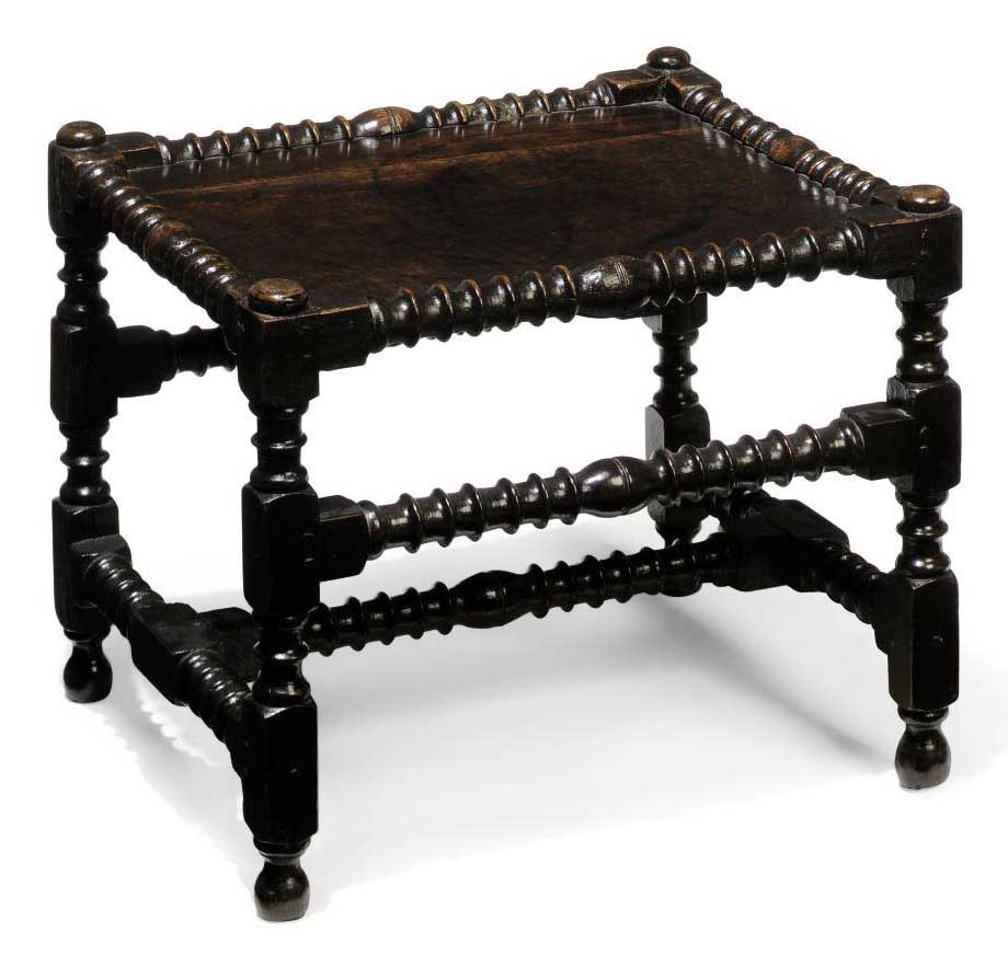 A CHARLES II OAK STOOL