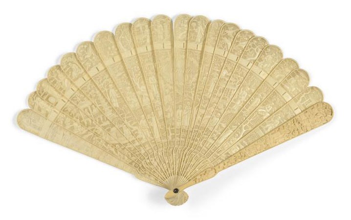 A CARVED IVORY BRISÉ FAN