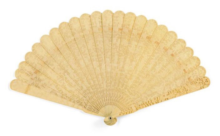 AN IVORY CARVED AND PIERCED BRISÉ FAN AND ANOTHER