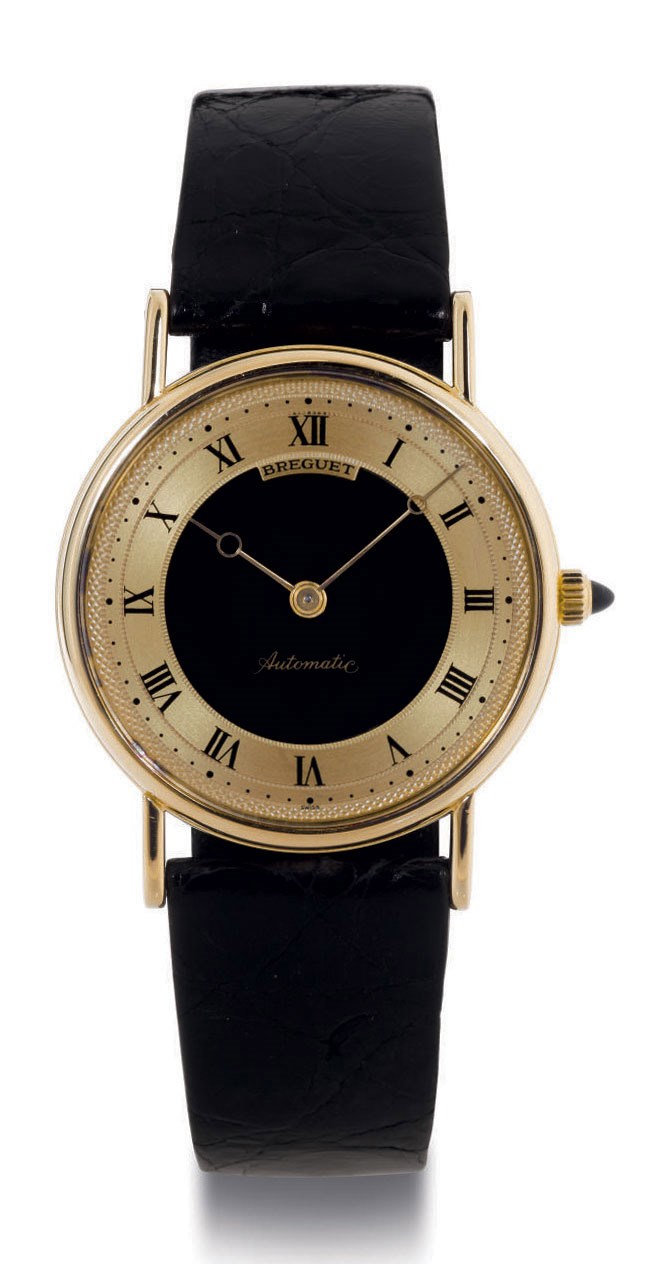 BREGUET.  AN 18K GOLD WRISTWATCH WITH BLACK DIAL