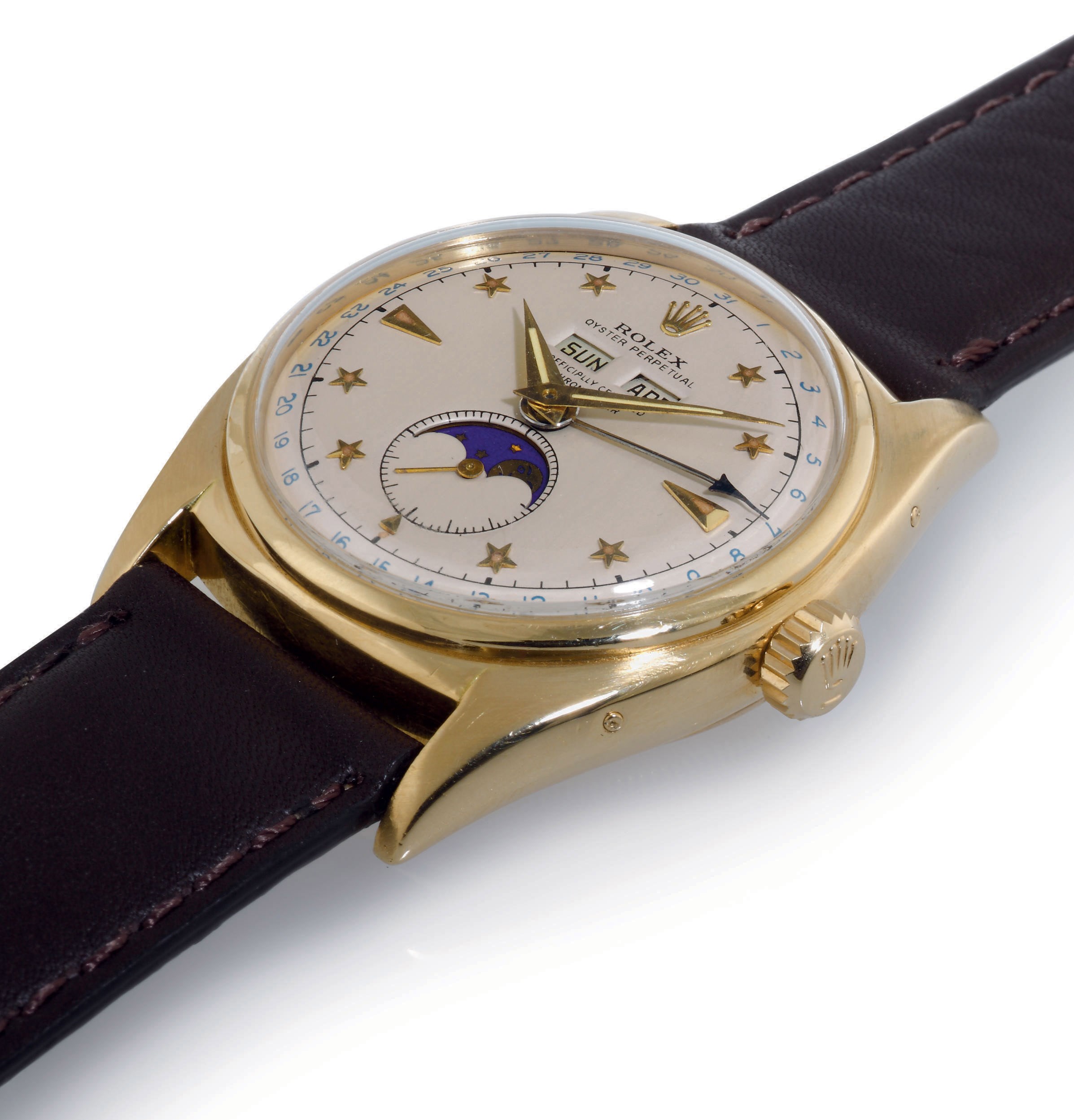 ROLEX. A FINE AND RARE 18K GOLD AUTOMATIC TRIPLE CALENDAR WRISTWATCH WITH STAR DIAL AND MOON PHASES