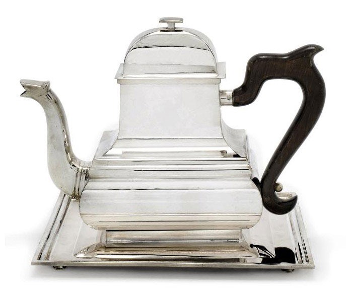 AN ITALIAN METALWARE TEAPOT AND STAND