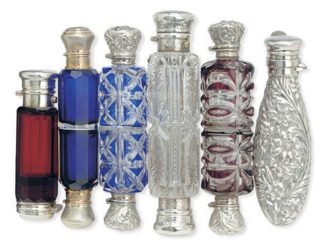 AN AMERICAN SILVER COVERED SCENT BOTTLE, AND FIVE DOUBLE-SIDED COVERED GLASS SCENT BOTTLES,