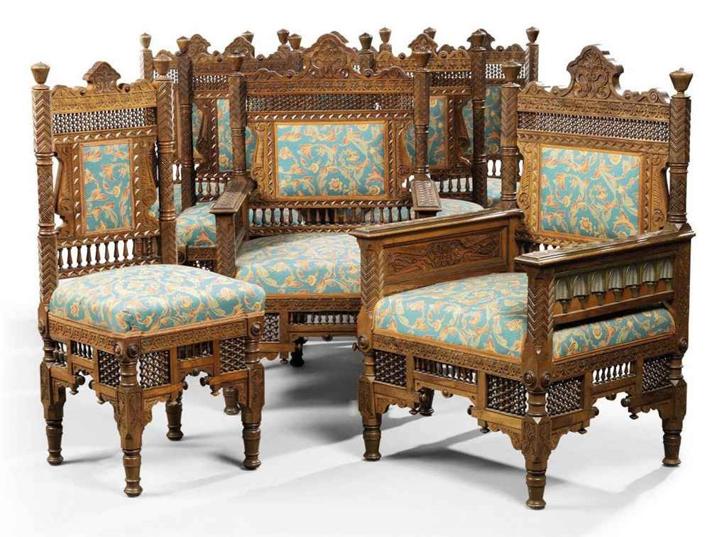 A SUITE OF EIGHT OAK AND UPHOLSTERED CHAIRS, PROBABLY RETAILED THROUGH LIBERTY & CO
