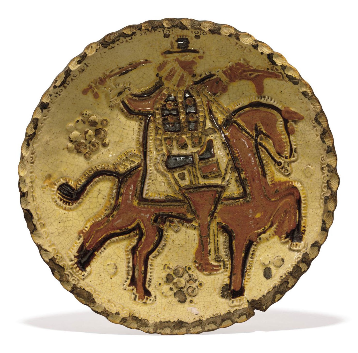 AN ENGLISH PRESS-MOLDED SLIPWARE DISH