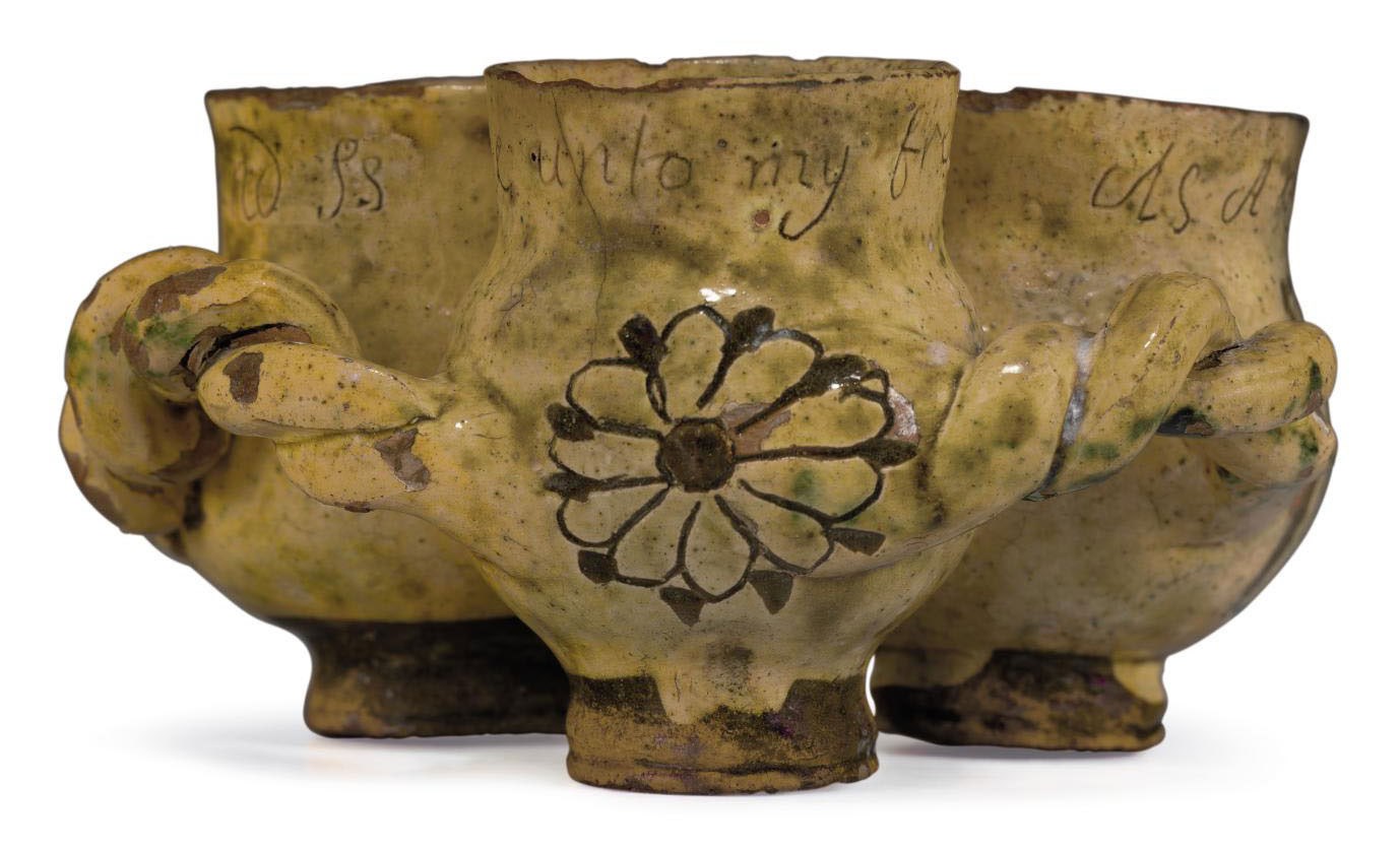 A DONYATT SGRAFFITO SLIPWARE INSCRIBED AND DATED FUDDLING-CUP