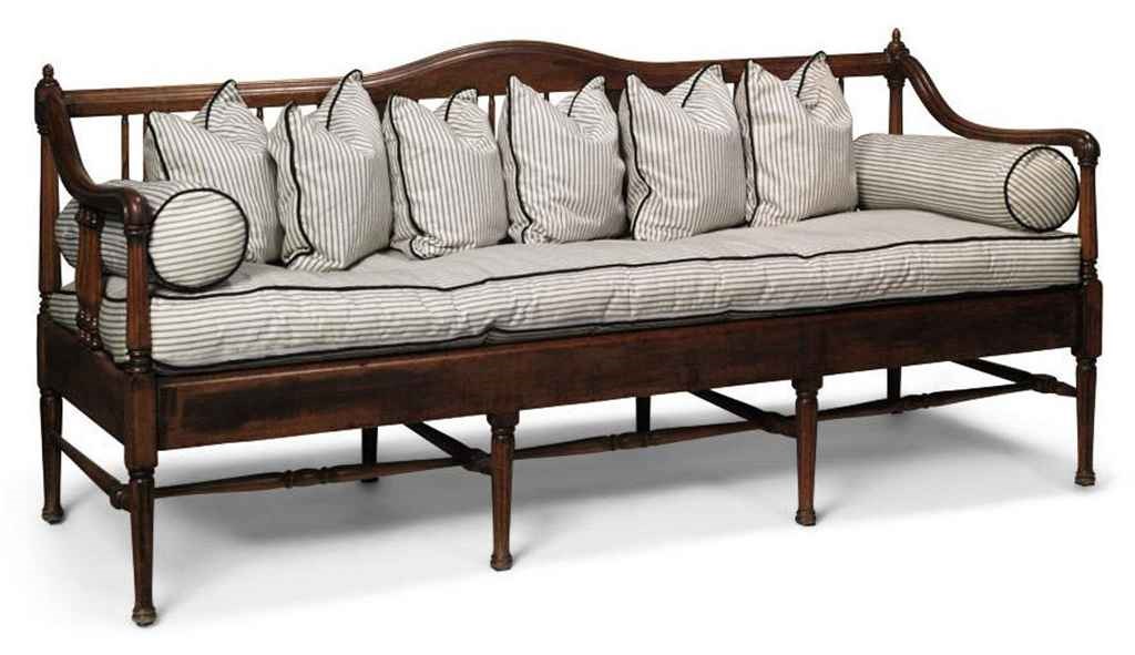 AN AMERICAN WALNUT SETTEE