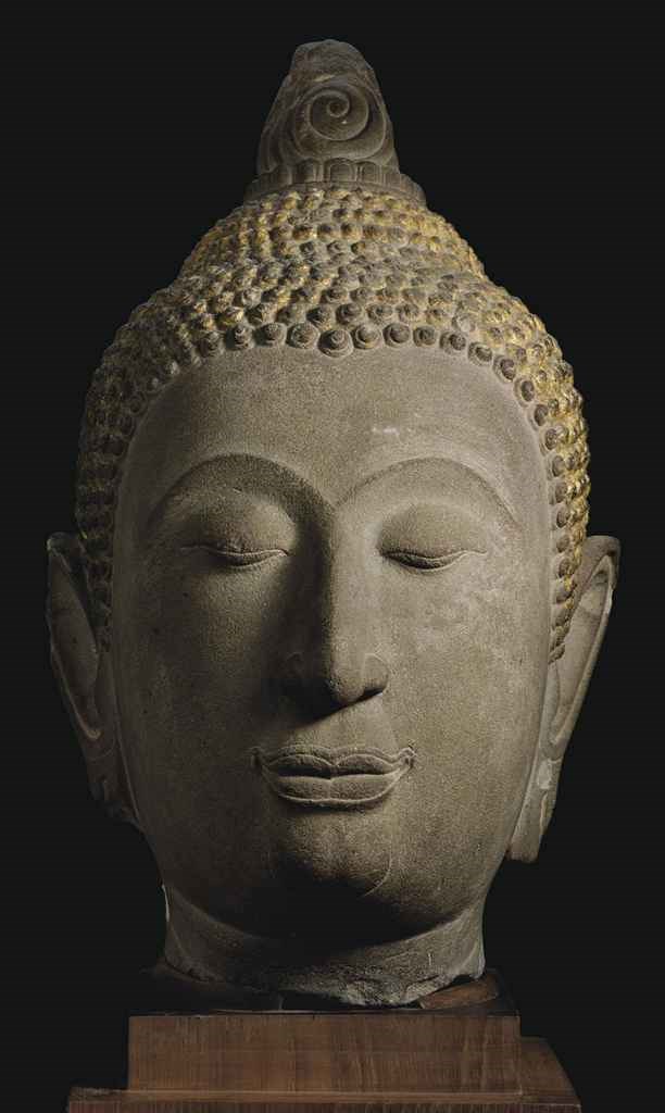 A large sandstone head of Buddha