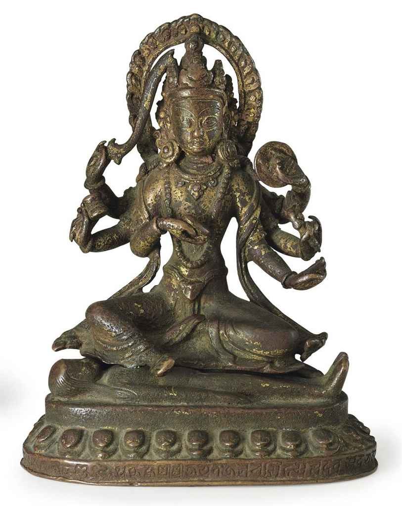 A gilt bronze figure of Kali