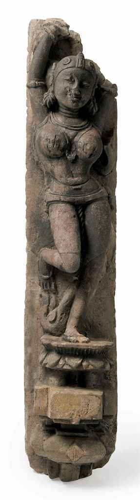 A sandstone figure of an Apsara