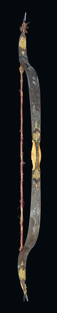 A GOLD DAMASCENED STEEL BOW