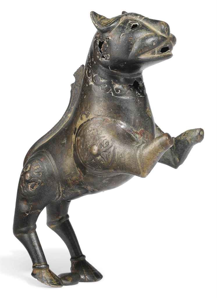 A KHORASSAN BRONZE LION
