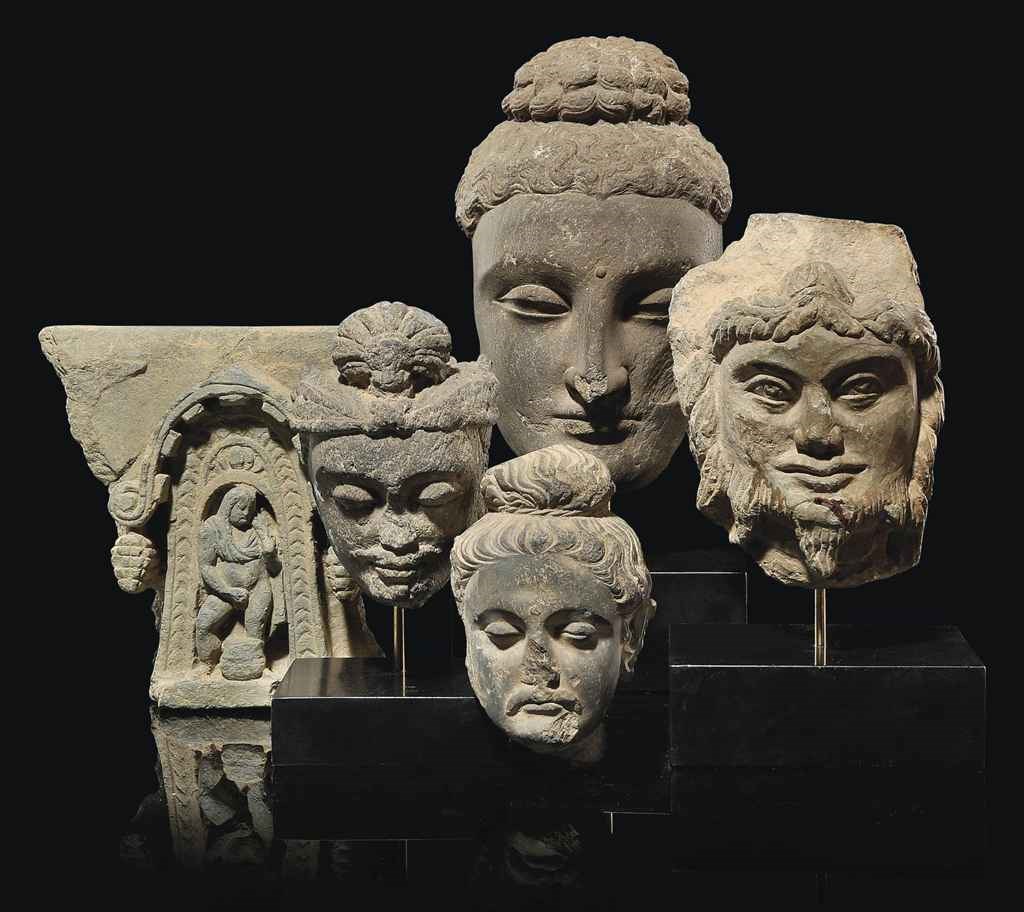 A GROUP OF CARVED BUDDHIST FIGURES
