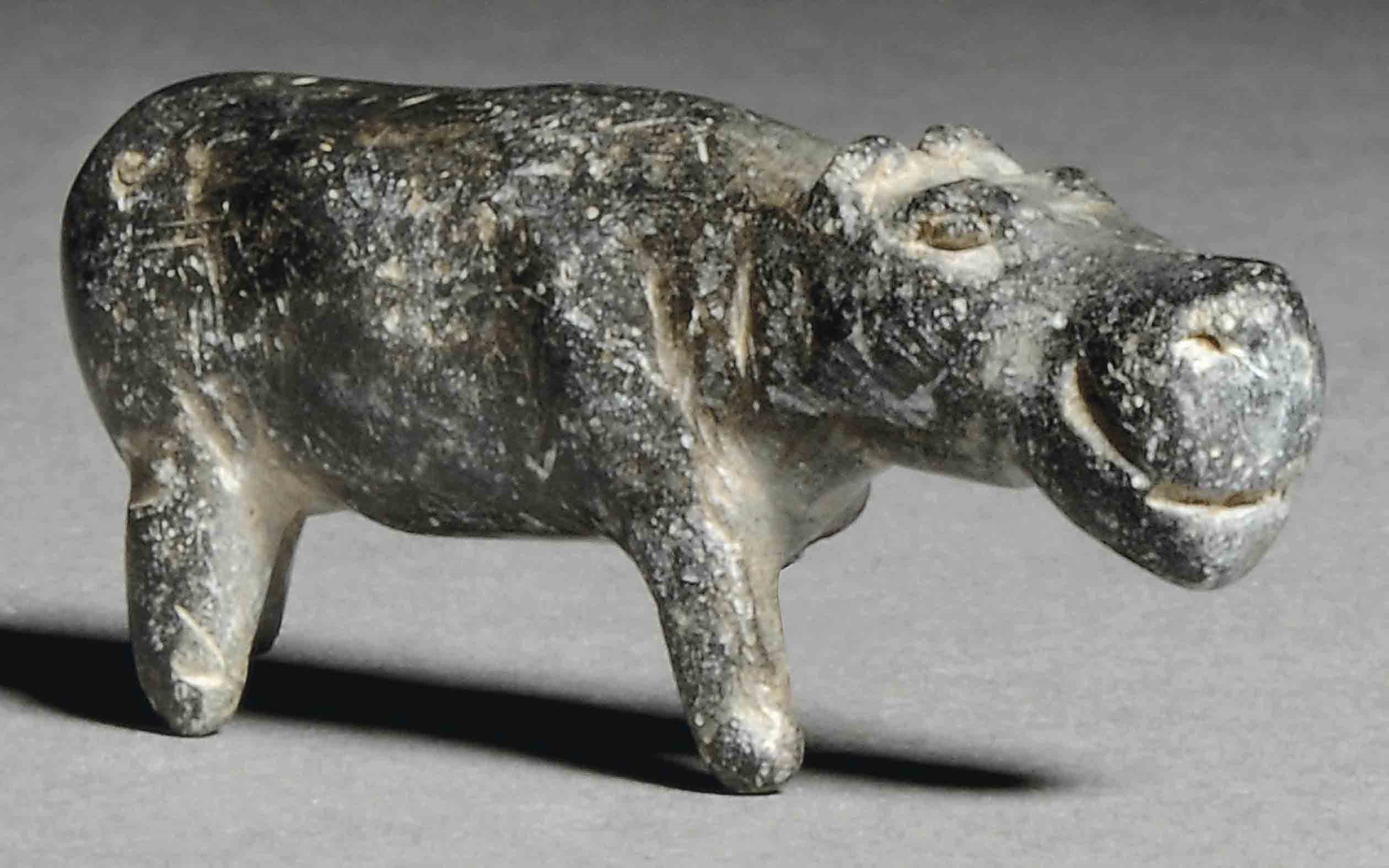 AN EGYPTIAN GREY SCHIST HIPPOPOTAMUS