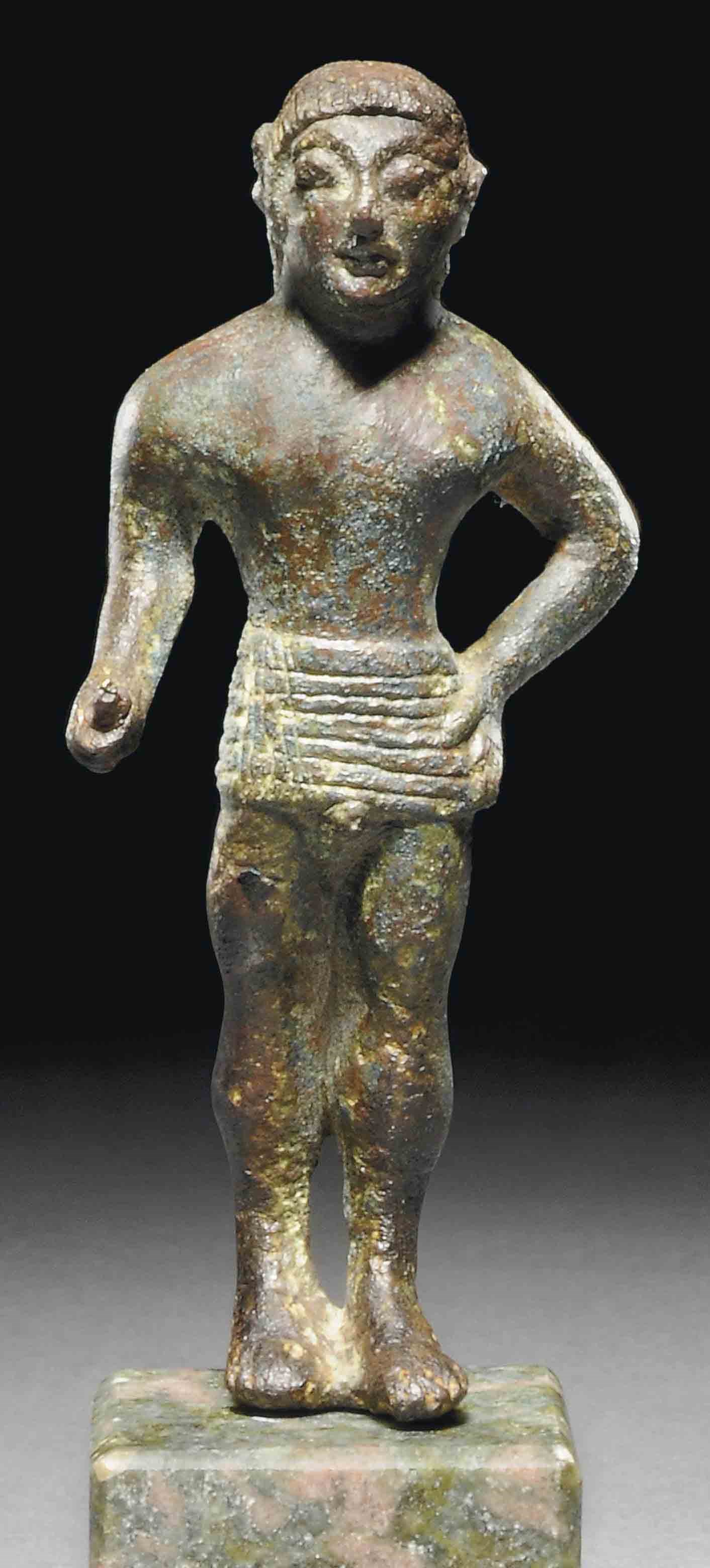 AN ETRUSCAN BRONZE YOUTH