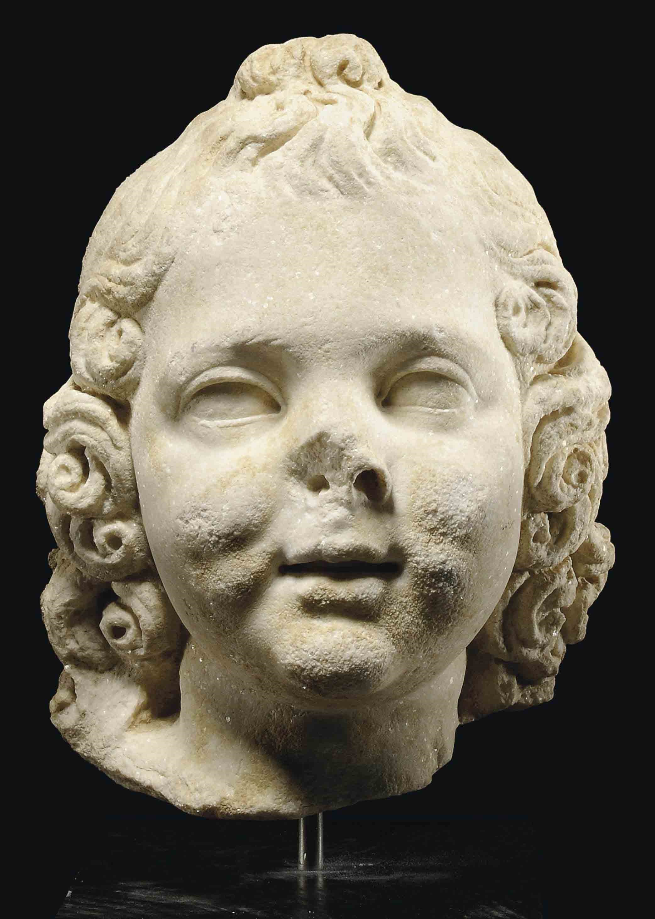 A ROMAN MARBLE HEAD OF EROS