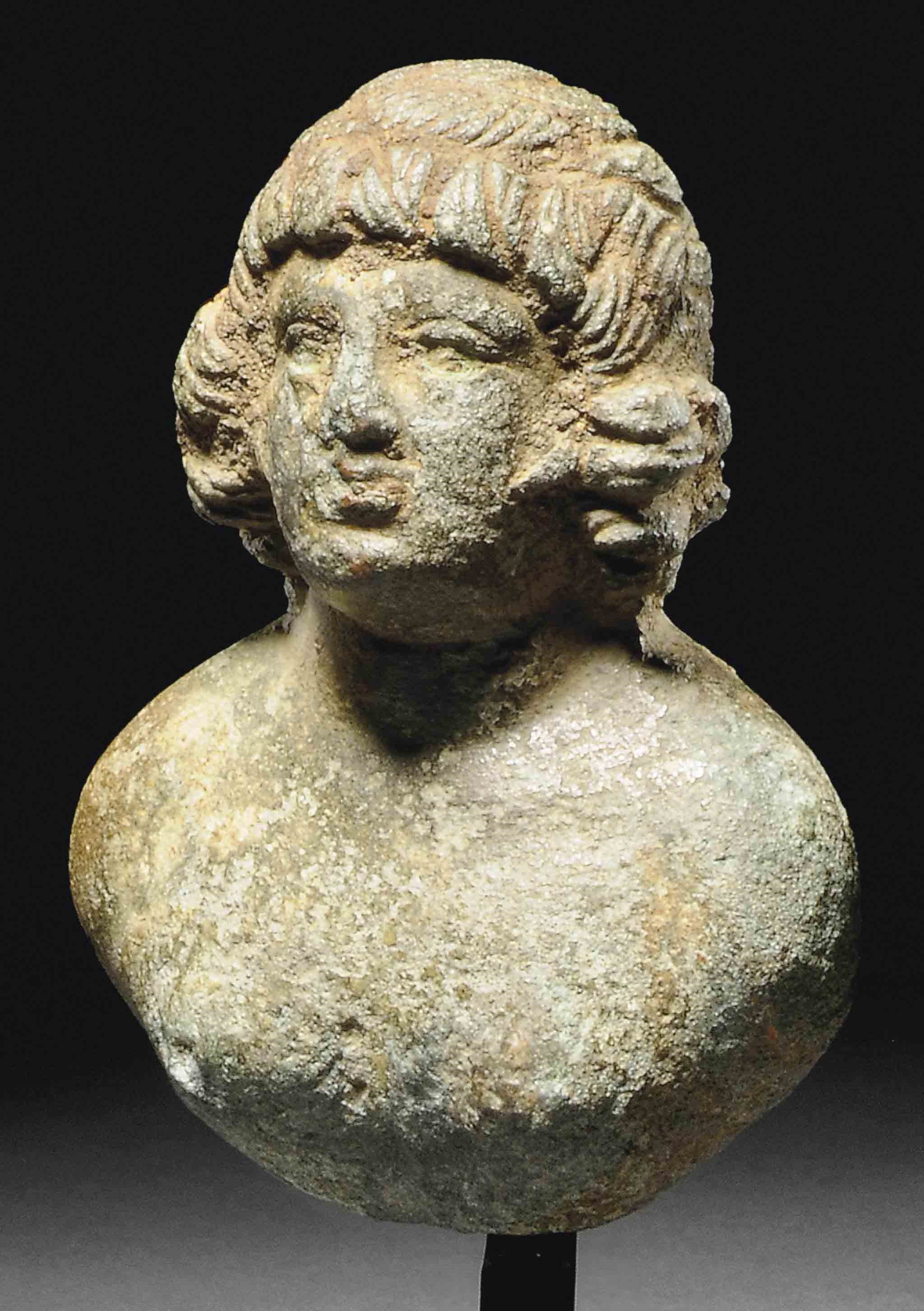 A ROMAN BRONZE BUST OF ANTINOUS