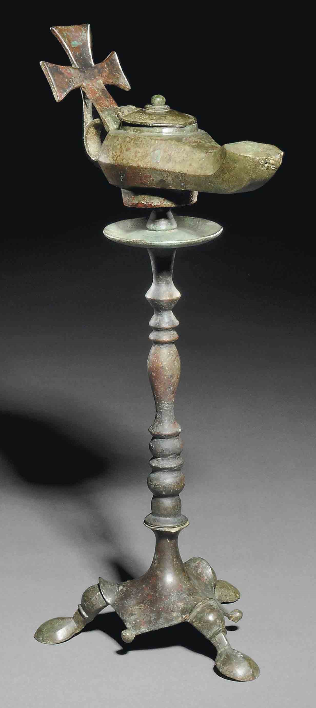 A BYZANTINE BRONZE LAMP AND STAND