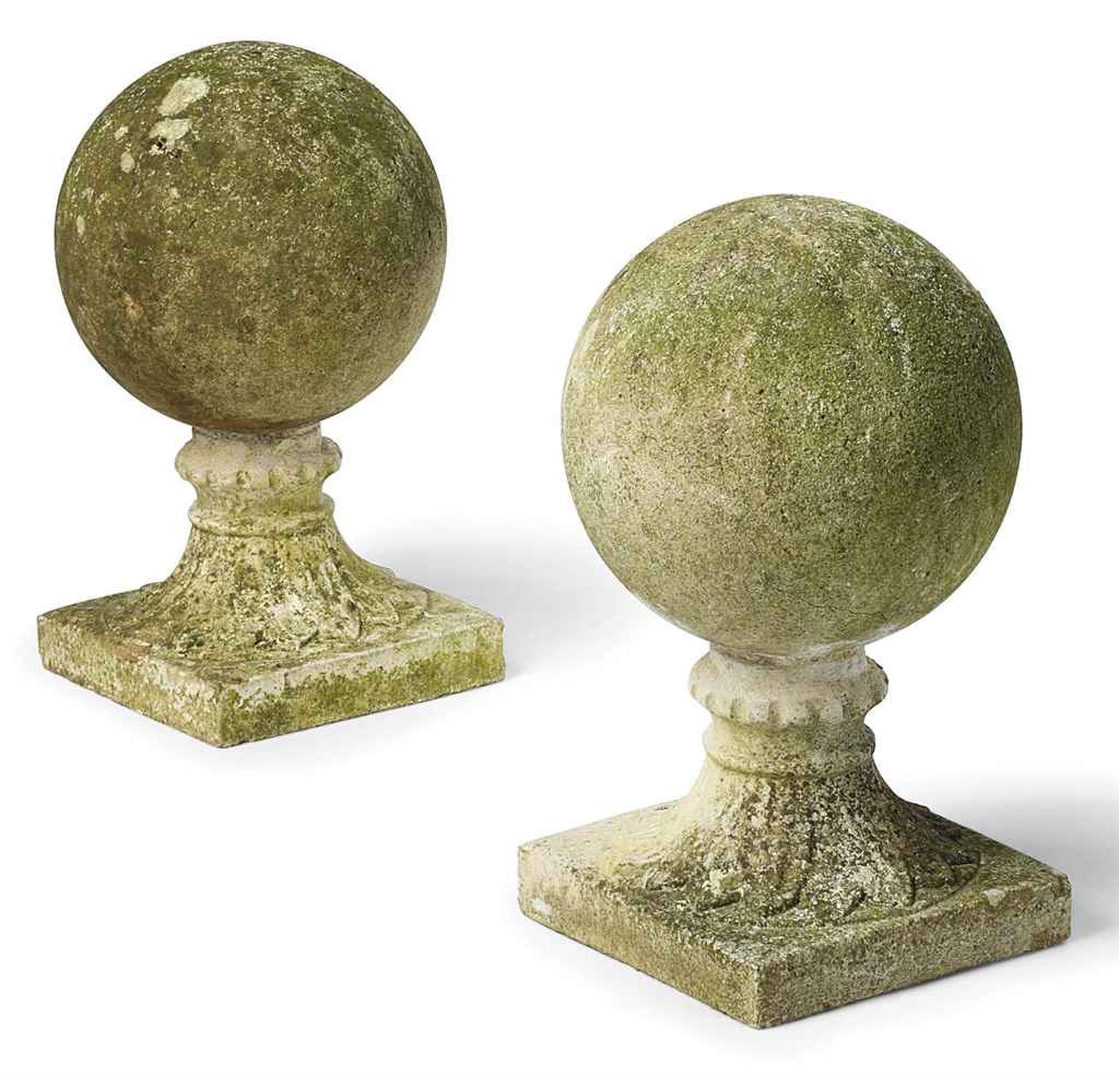 A PAIR OF COMPOSITION STONE SPHERE FINIALS