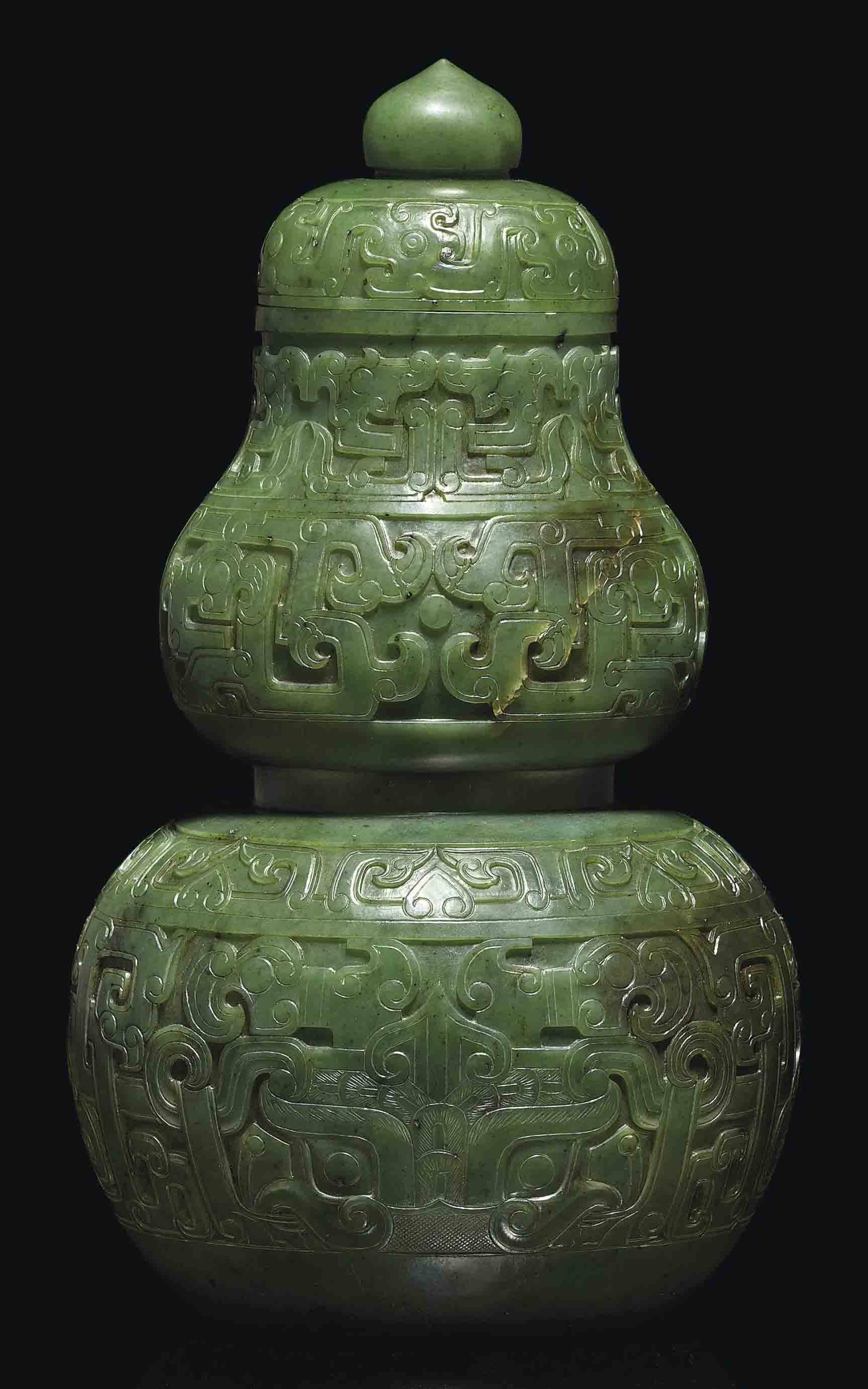 A LARGE SPINACH GREEN JADE DOUBLE-GOURD VASE AND COVER