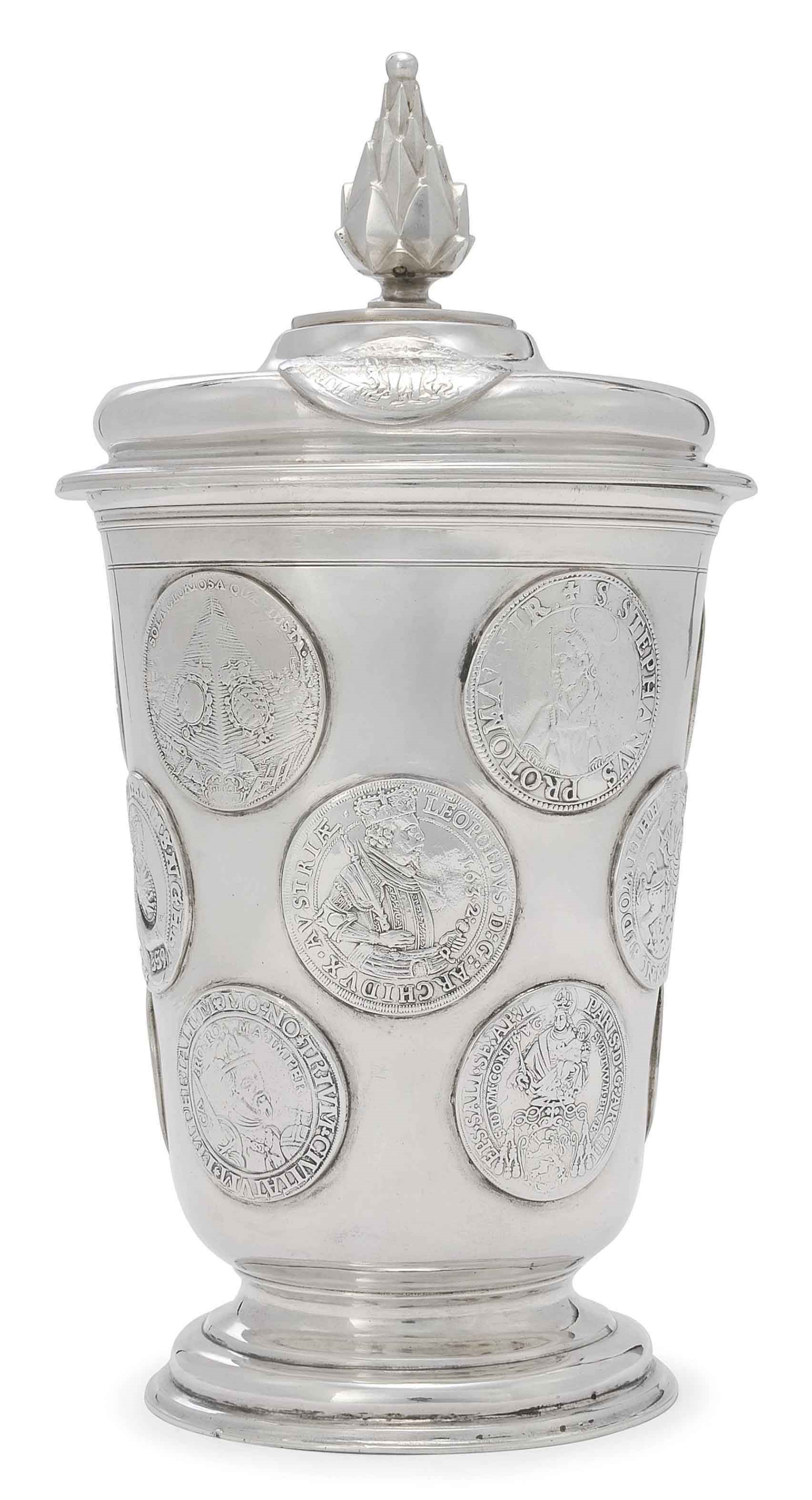 A GERMAN SILVER BEAKER AND COVER