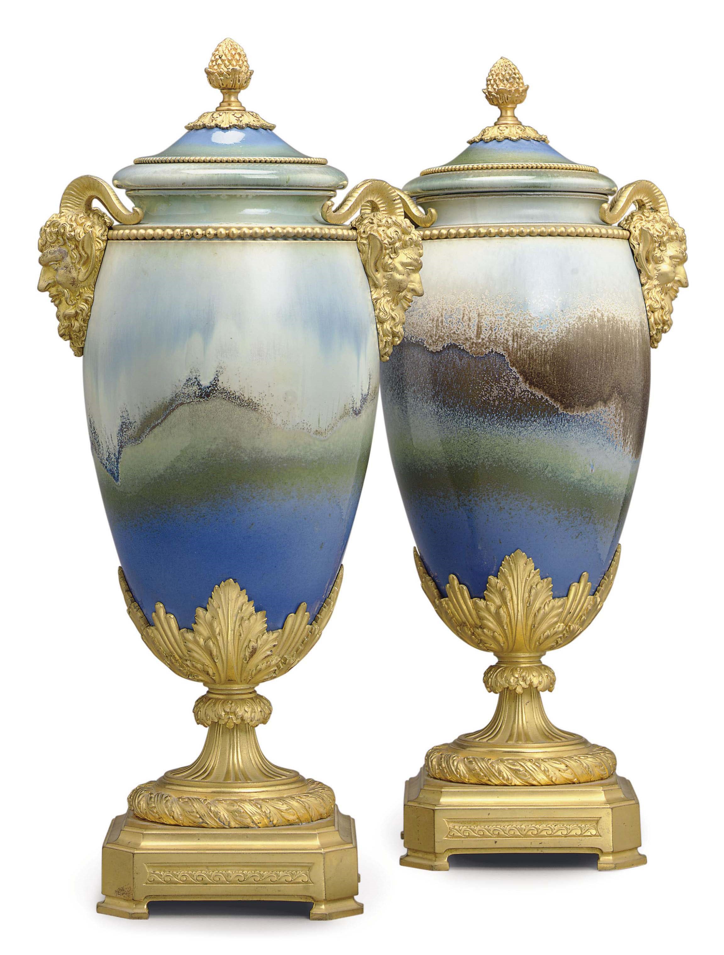 A PAIR OF ORMOLU-MOUNTED PARIS PORCELAIN FLAMBE-GROUND VASES AND COVERS