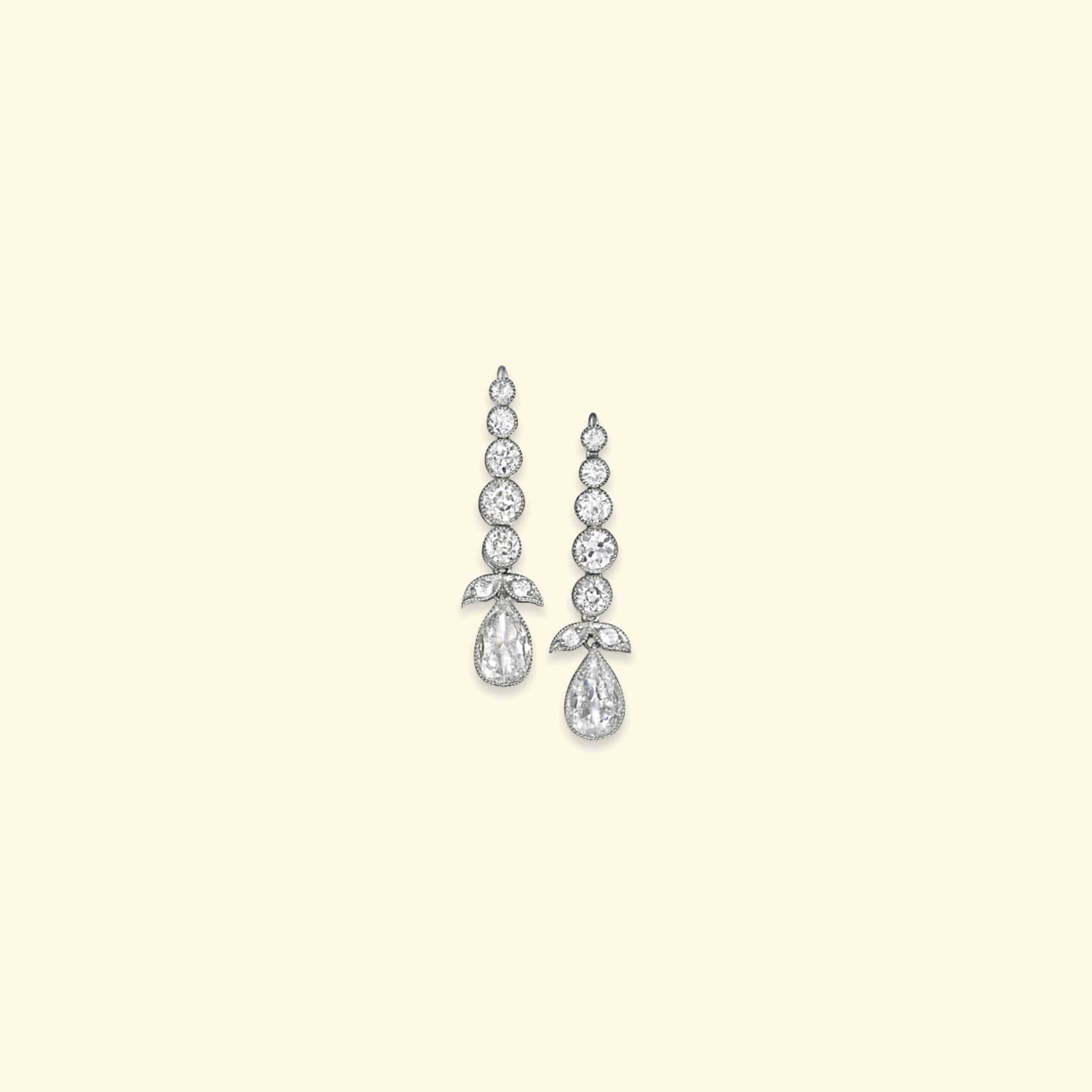 A PAIR OF DIAMOND EAR PENDANTS