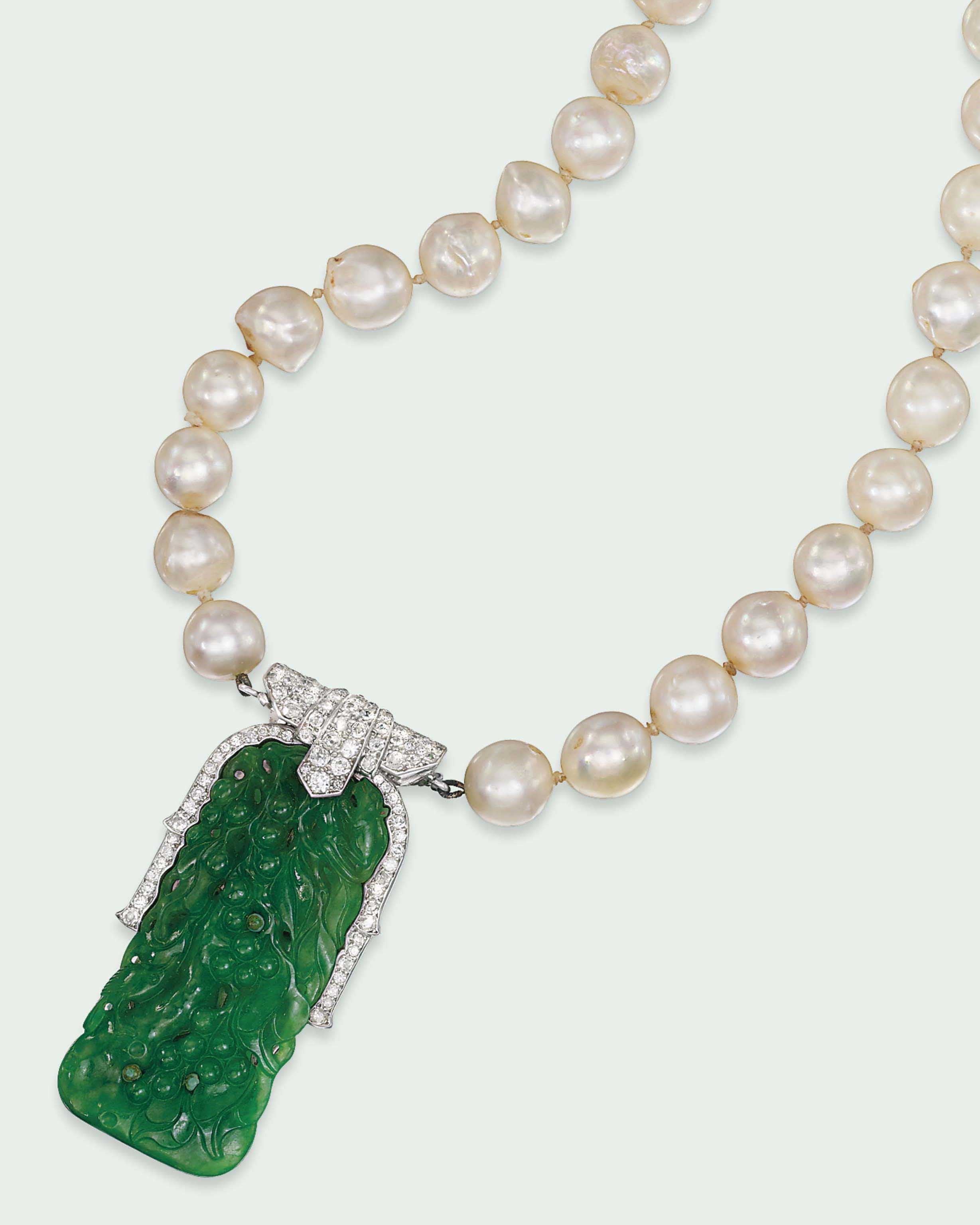 AN ART DECO JADE AND DIAMOND PENDANT, BY CARTIER
