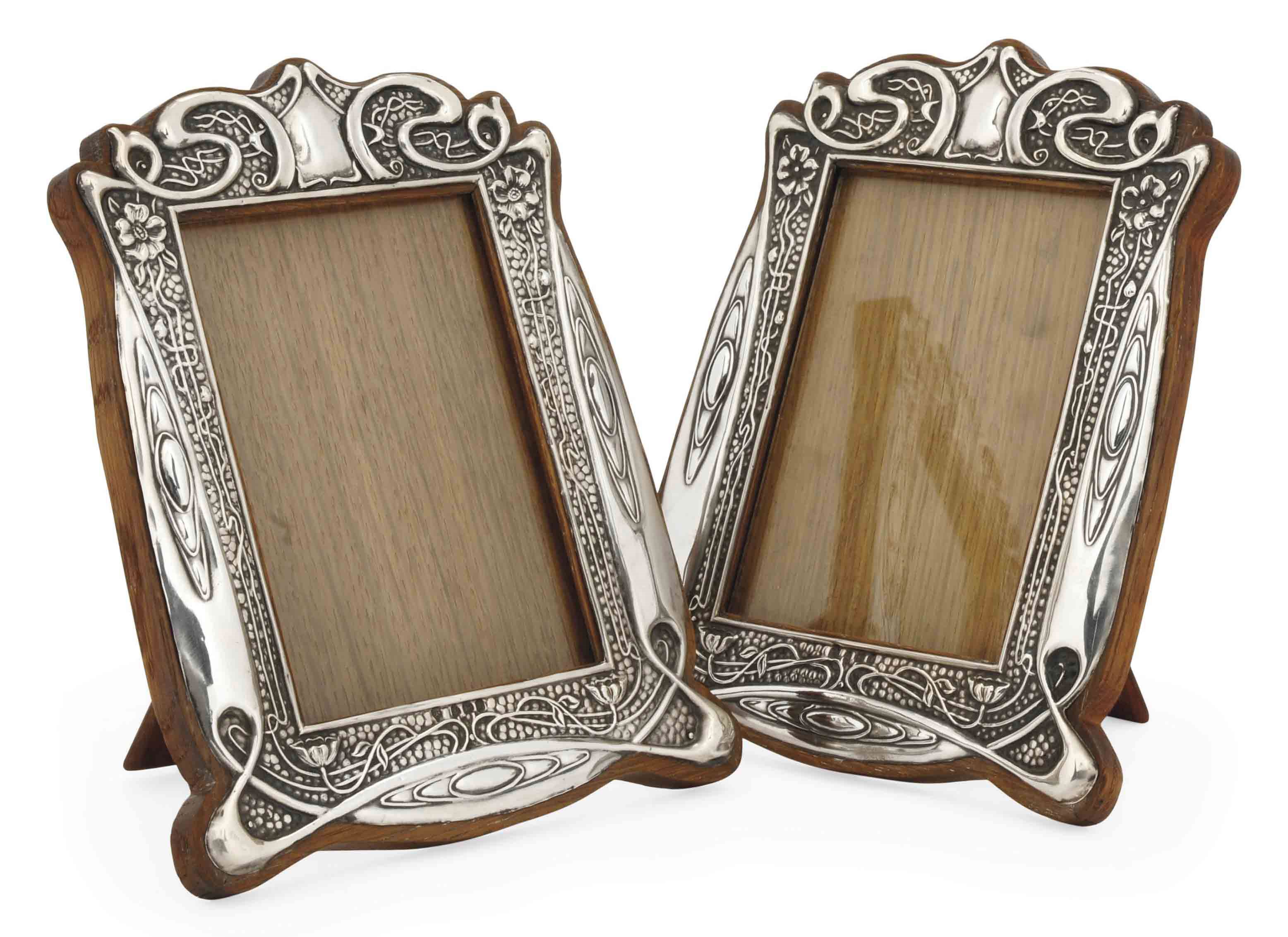 A PAIR OF ART NOUVEAU SILVER PHOTOGRAPH FRAMES