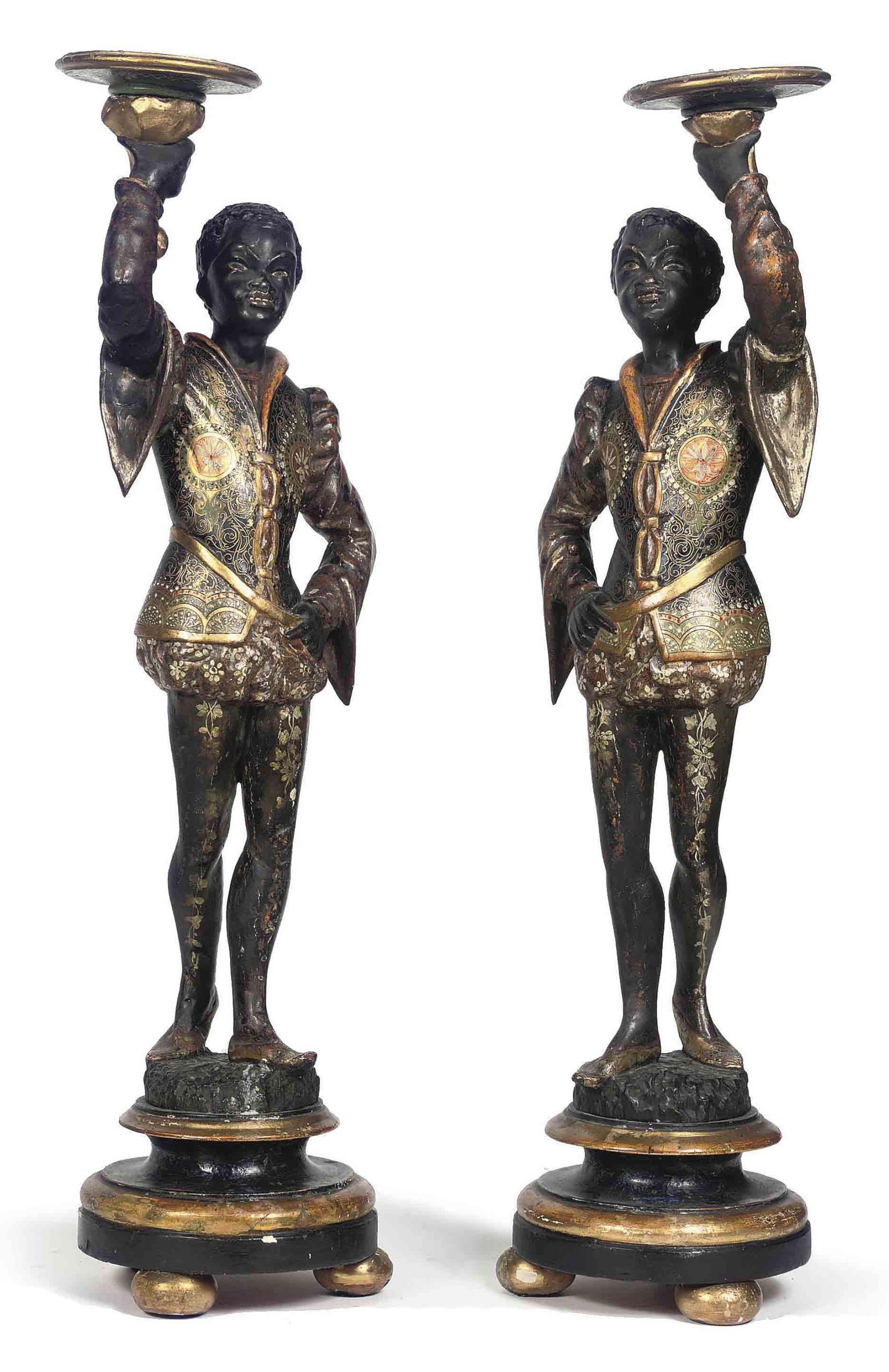 A PAIR OF ITALIAN PARCEL-GILT POLYCHROME CARVED WOOD BLACKAMOOR CANDLESTICKS
