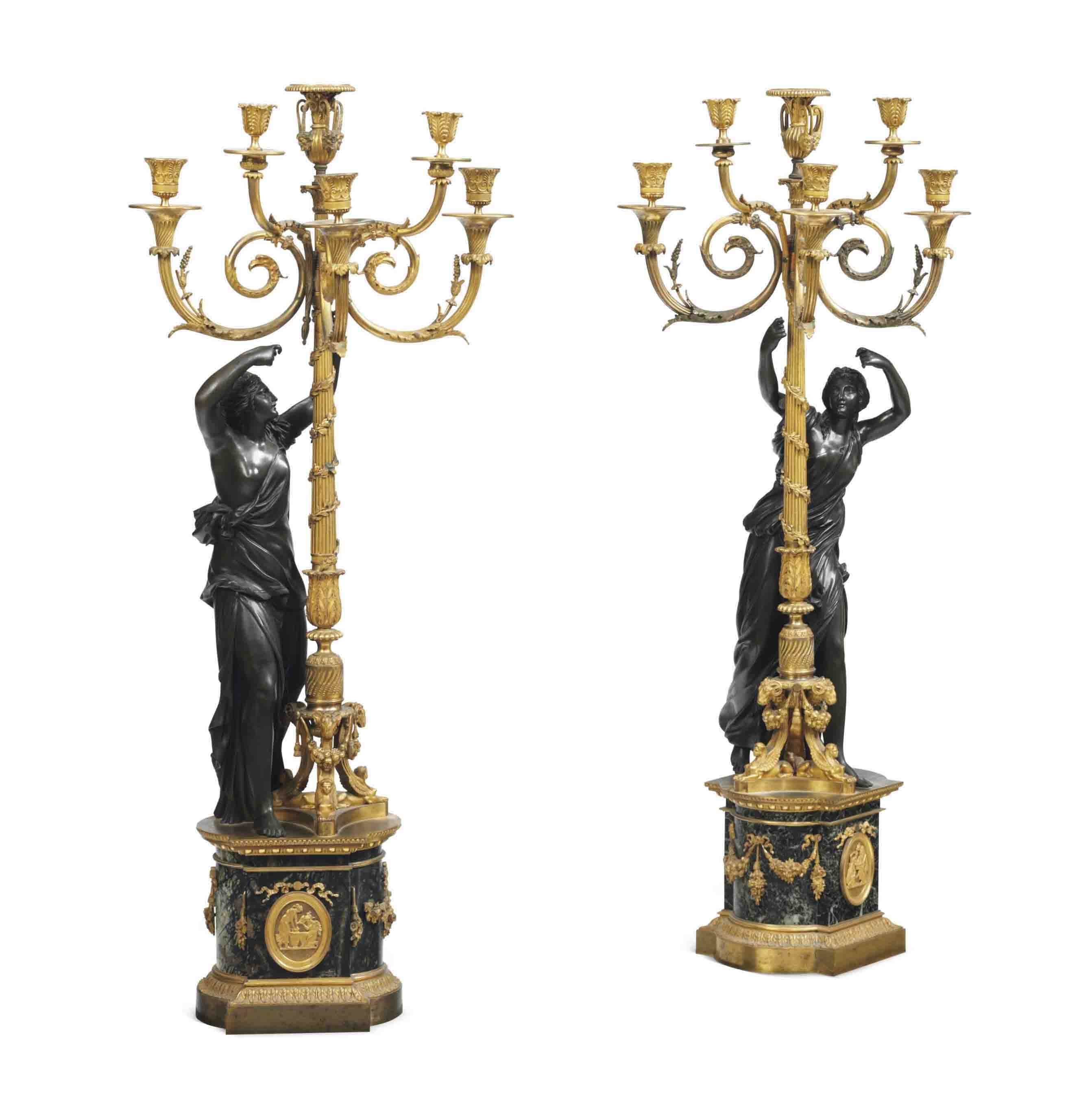 A PAIR OF RESTAURATION ORMOLU AND PATINATED BRONZE FIVE-LIGHT CANDELABRA