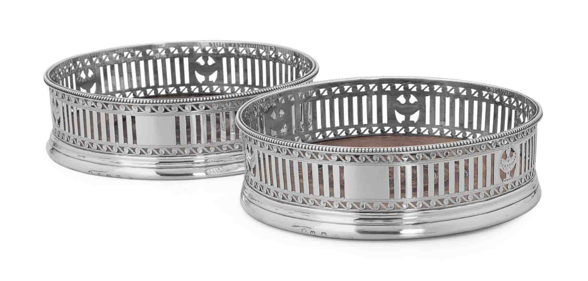 A PAIR OF GEORGE III SILVER WINE COASTERS