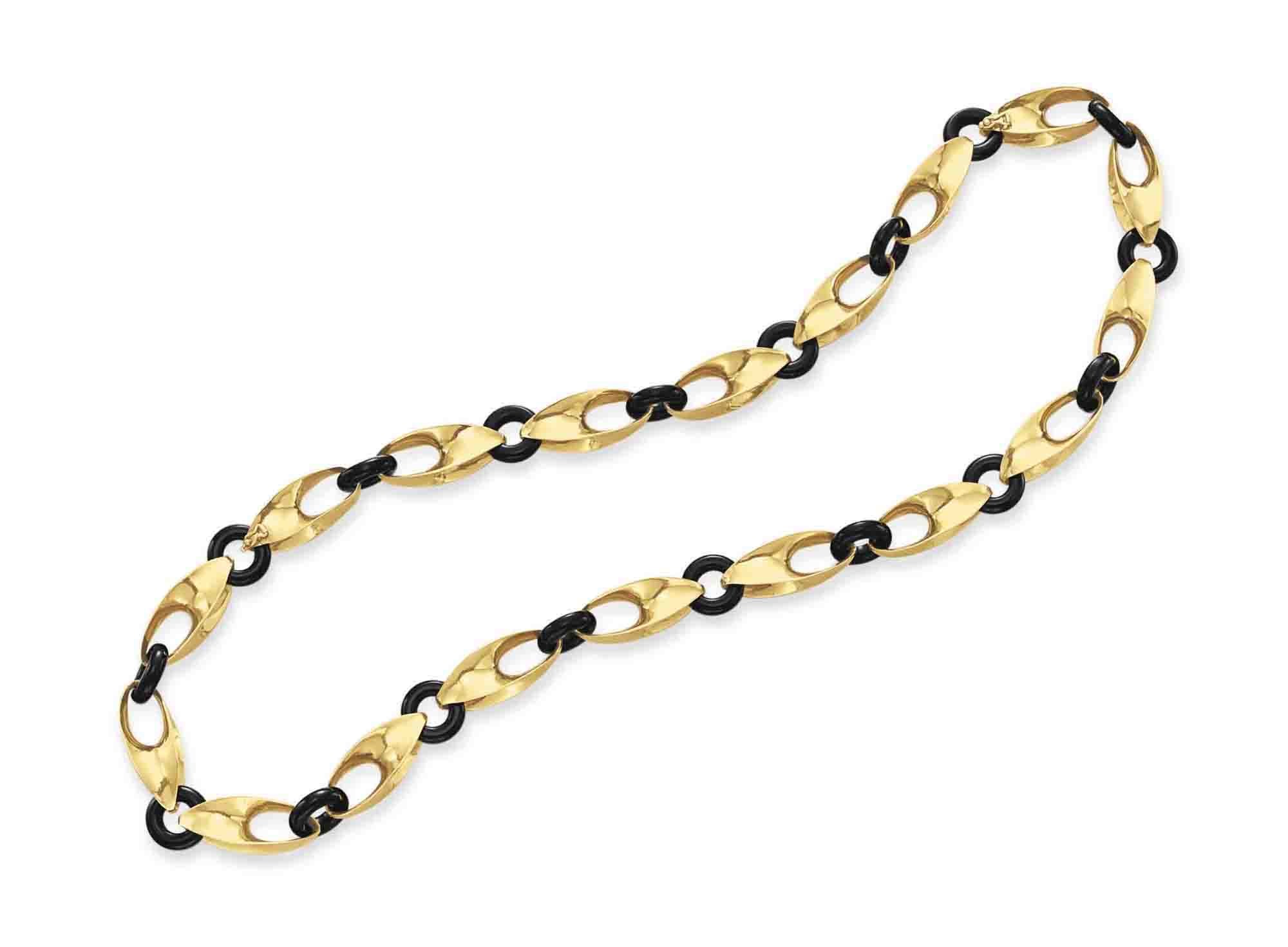 AN ONYX AND GOLD NECKLACE, BY CARTIER
