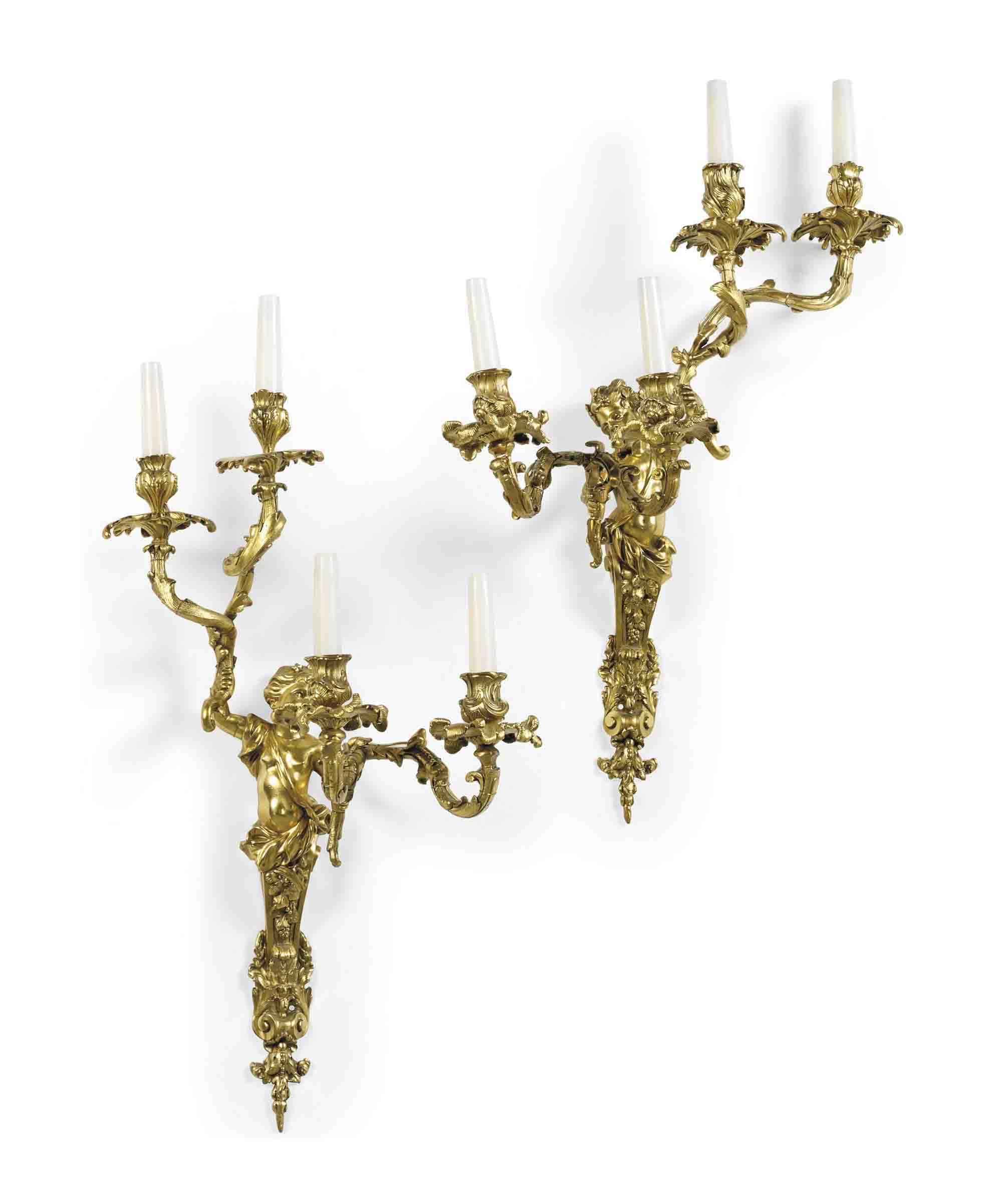 A PAIR OF LACQUERED BRONZE WALL APPLIQUES
