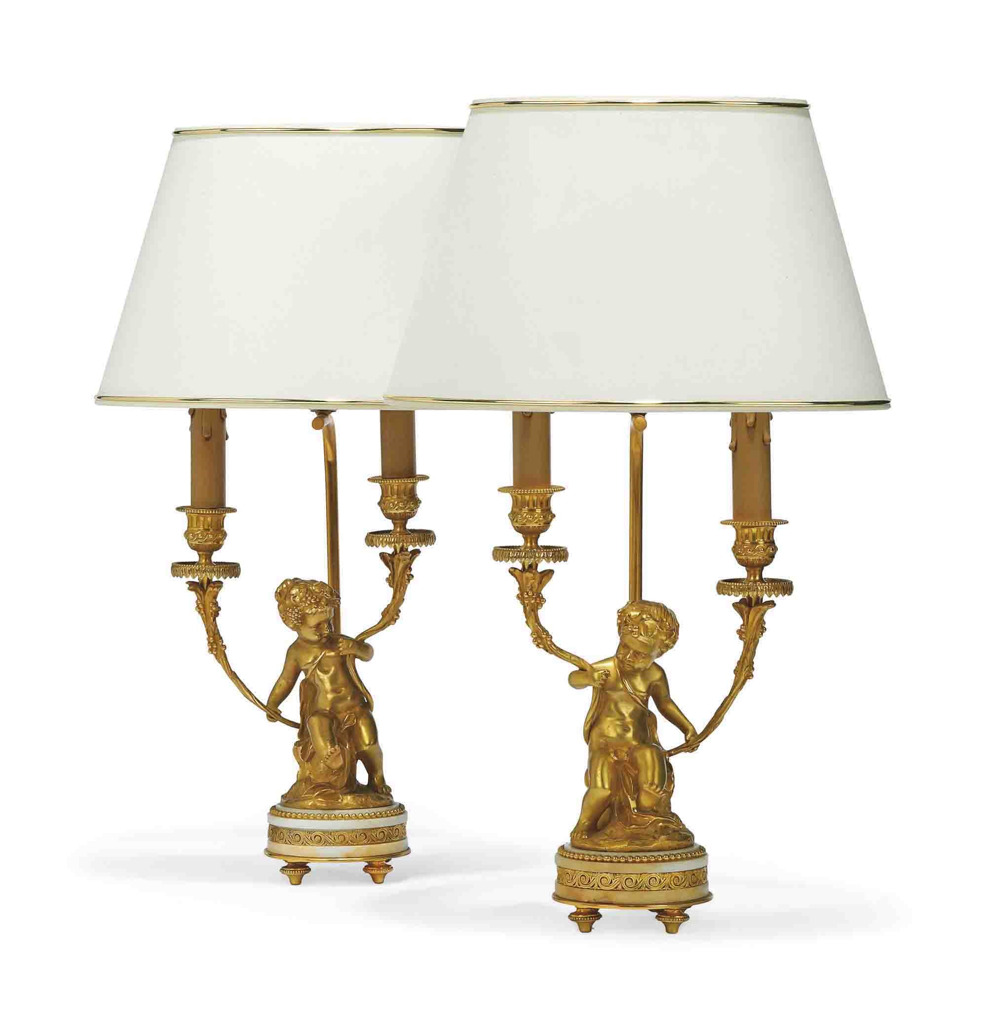 A PAIR OF FRENCH MARBLE MOUNTED ORMOLU CANDELABRAS