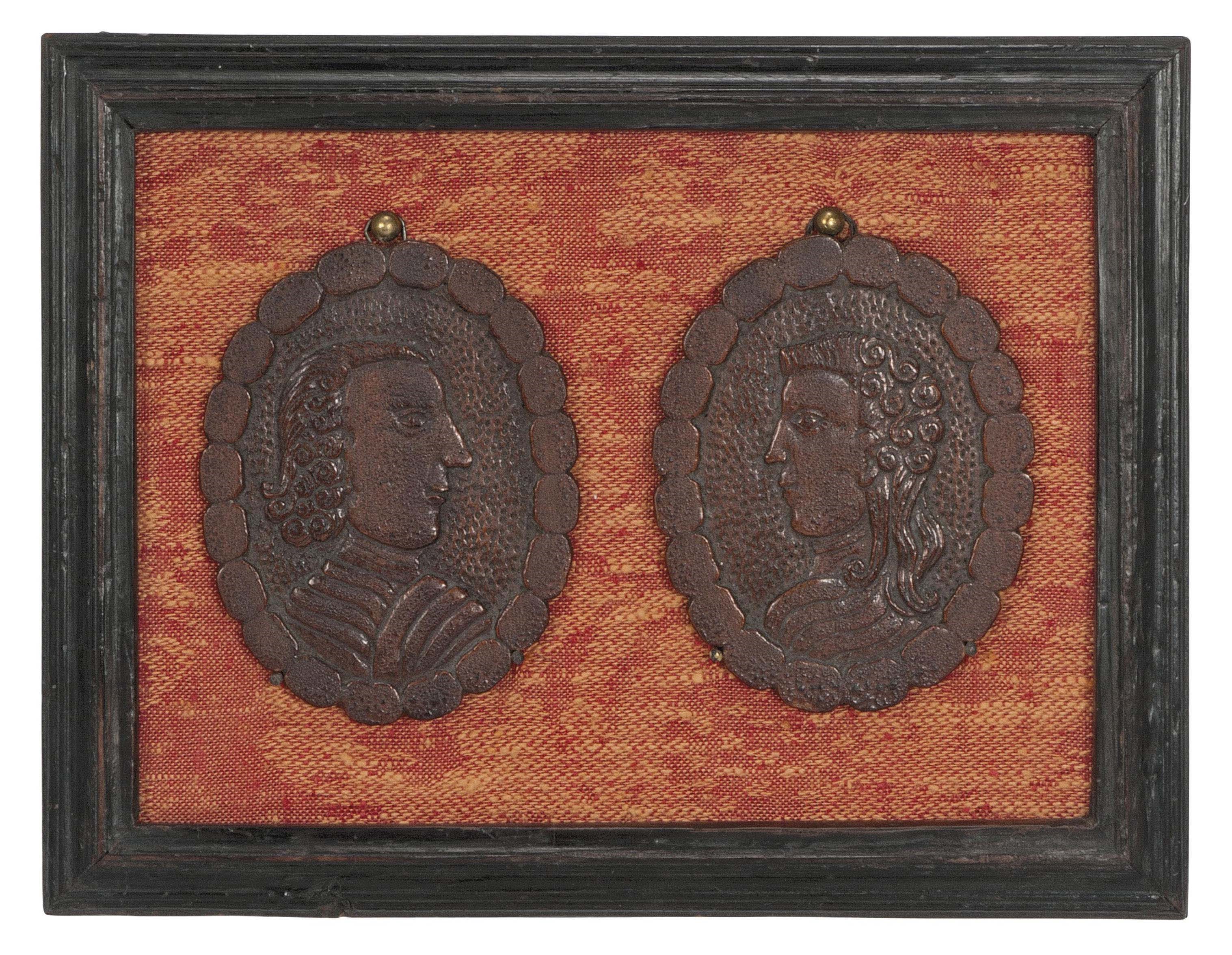 A PAIR OF ENGLISH TREEN PORTRAIT MEDALLIONS
