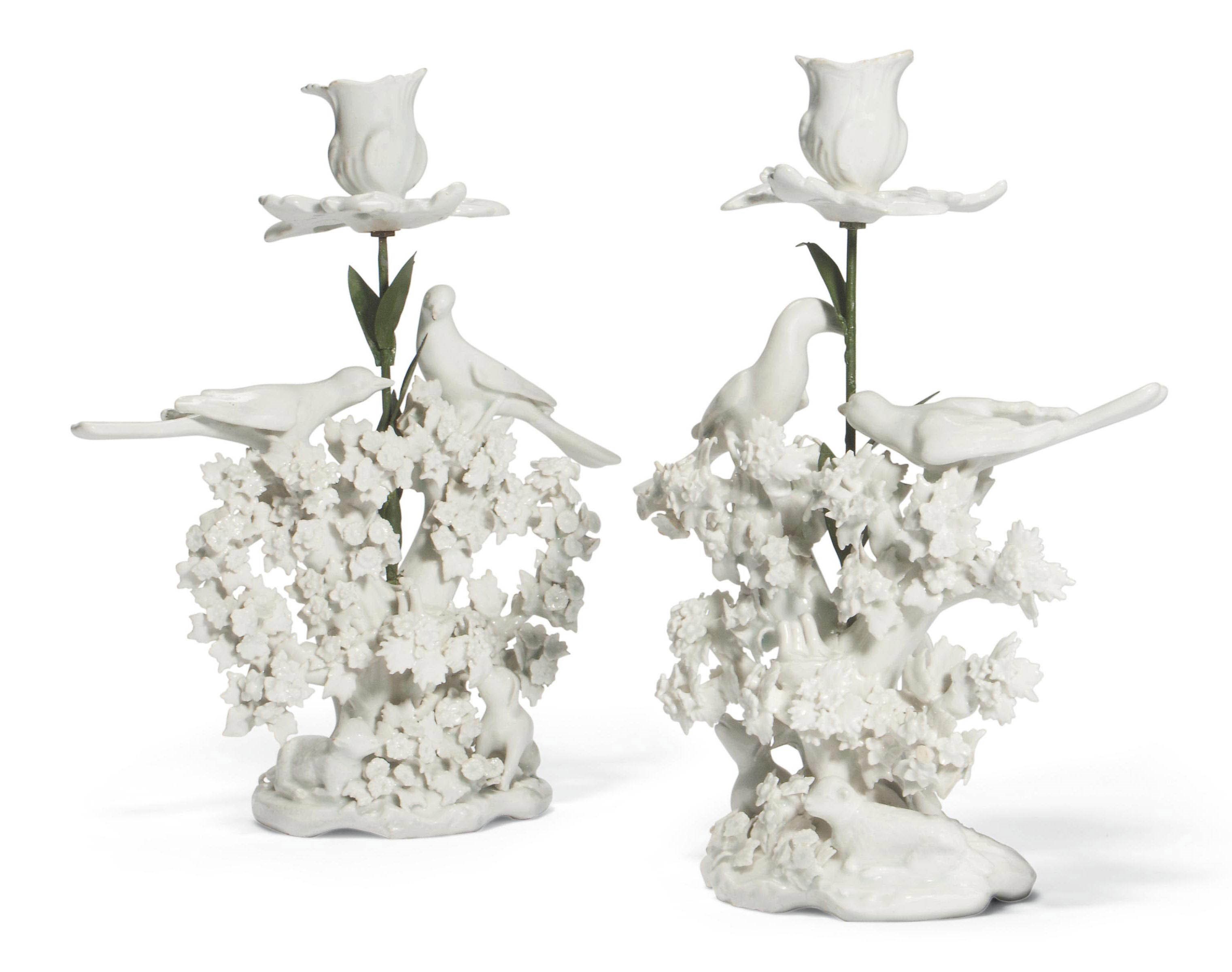 A  PAIR OF BOW WHITE 'BIRDS IN BRANCHES' CANDLESTICK GROUPS