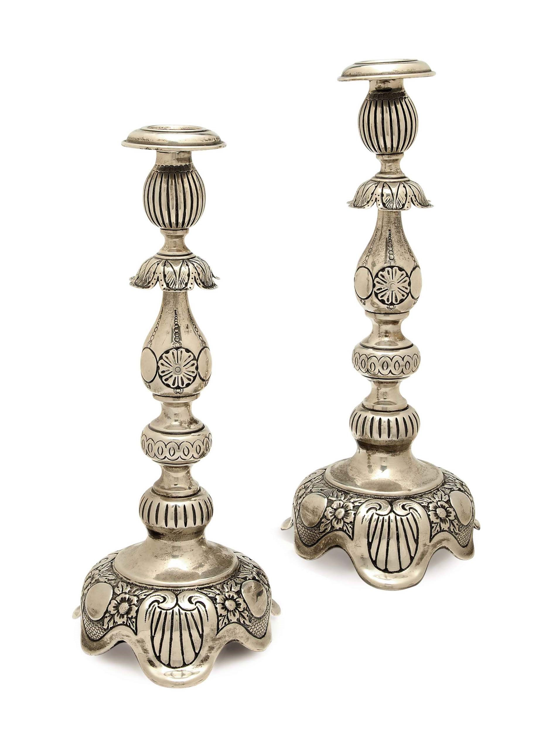 A PAIR OF SILVER CANDLESTICKS AND NOZZLES,