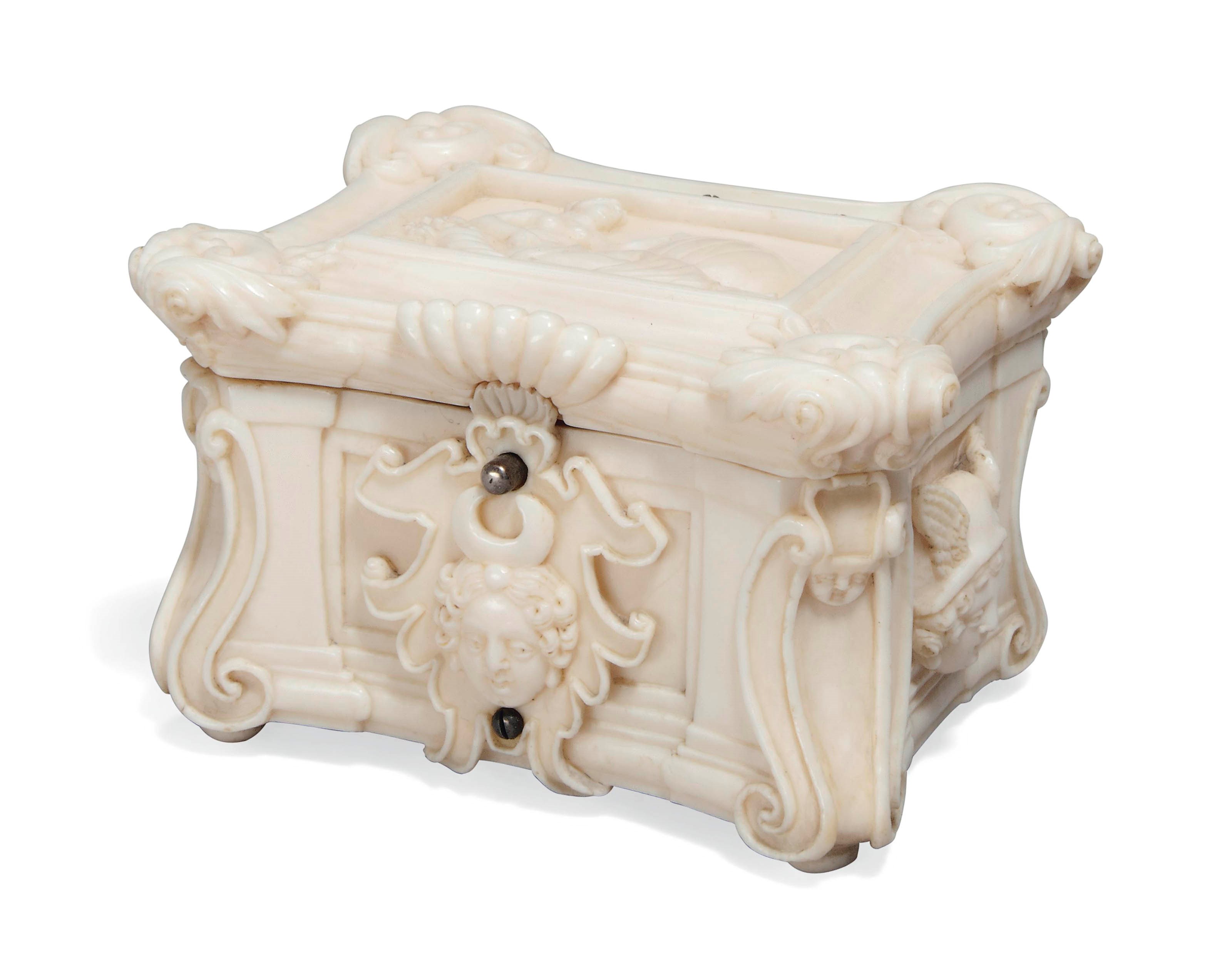 A CARVED IVORY MINIATURE CASKET