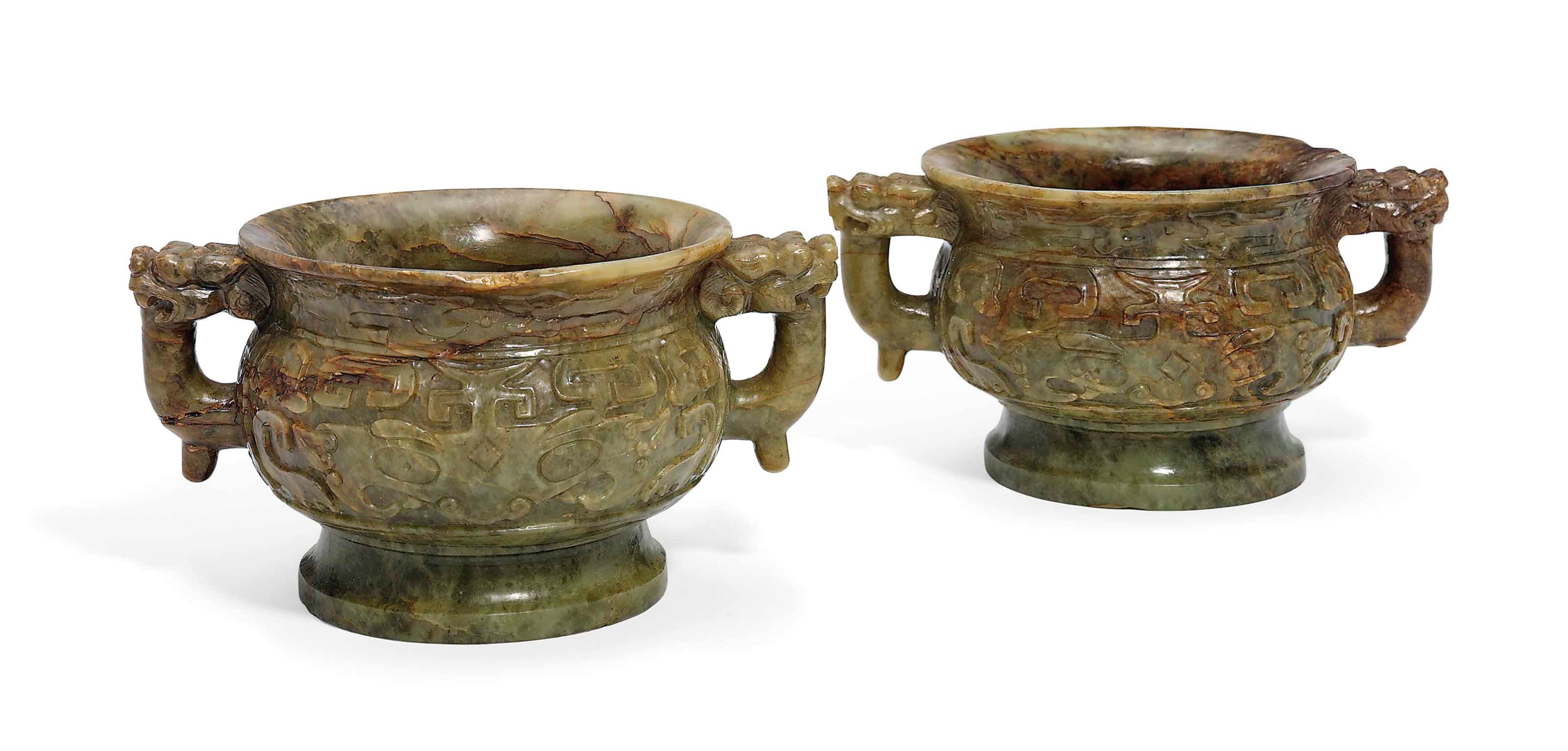 A PAIR OF CHINESE CELADON AND RUSSET JADE GUI-SHAPED CENSERS