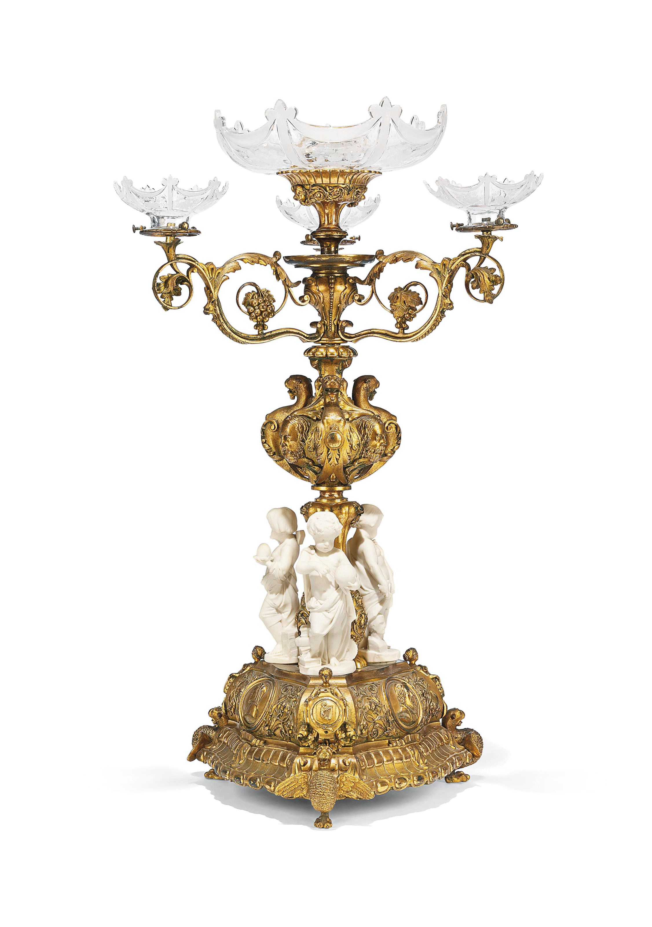 A MID-VICTORIAN GILT-BRASS AND PARIANWARE FIGURAL CENTREPIECE