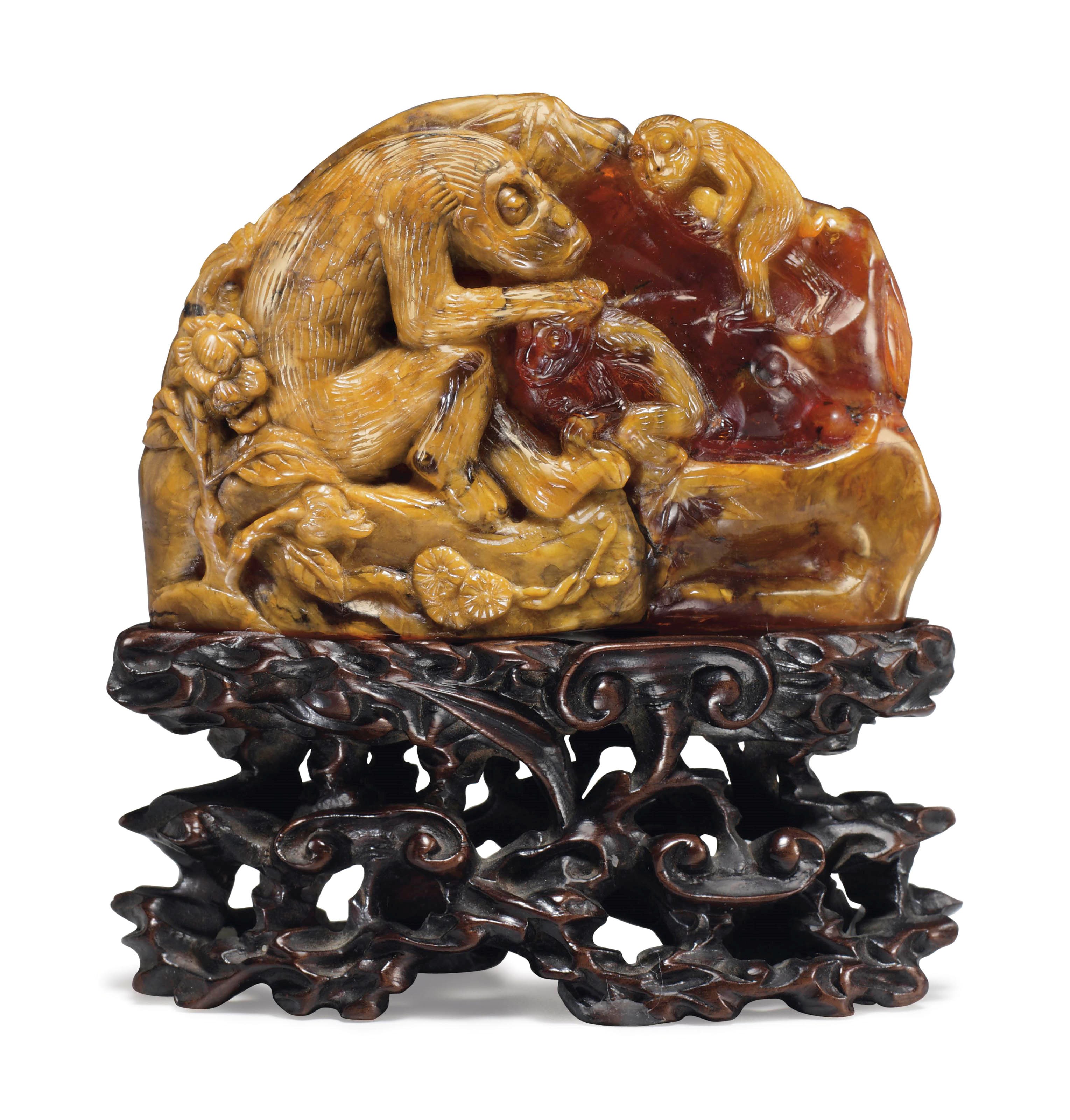 A RARE AMBER MOUNTAIN CARVING