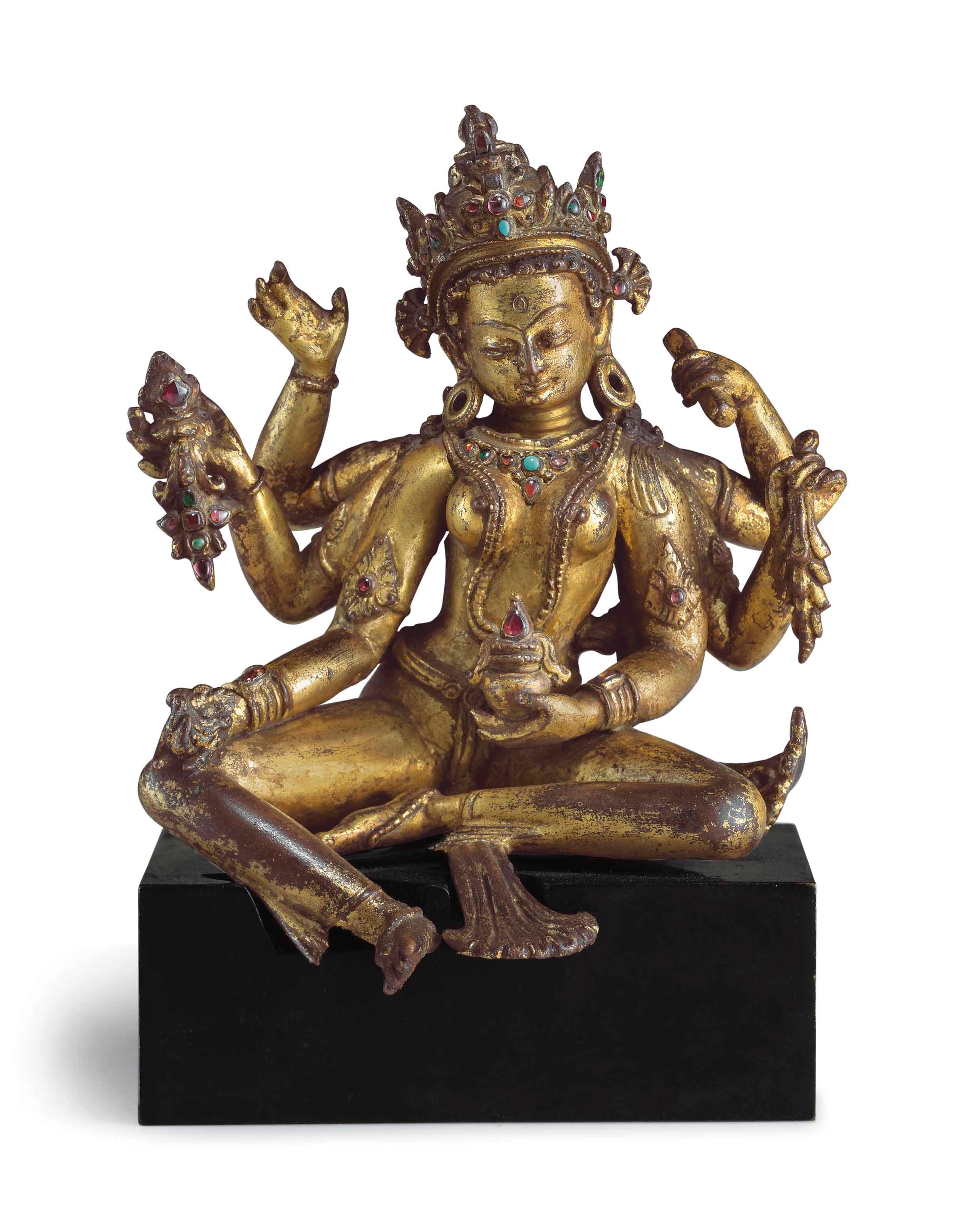 A gilt copper figure of Vasudhara