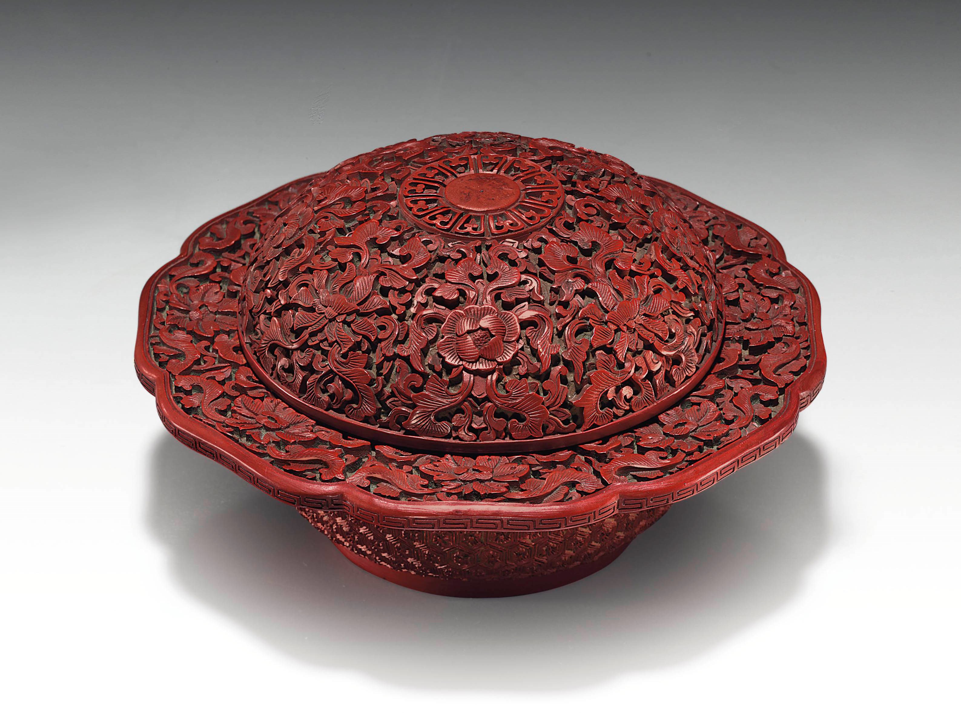 A CARVED RED LACQUER ZHADOU AND COVER