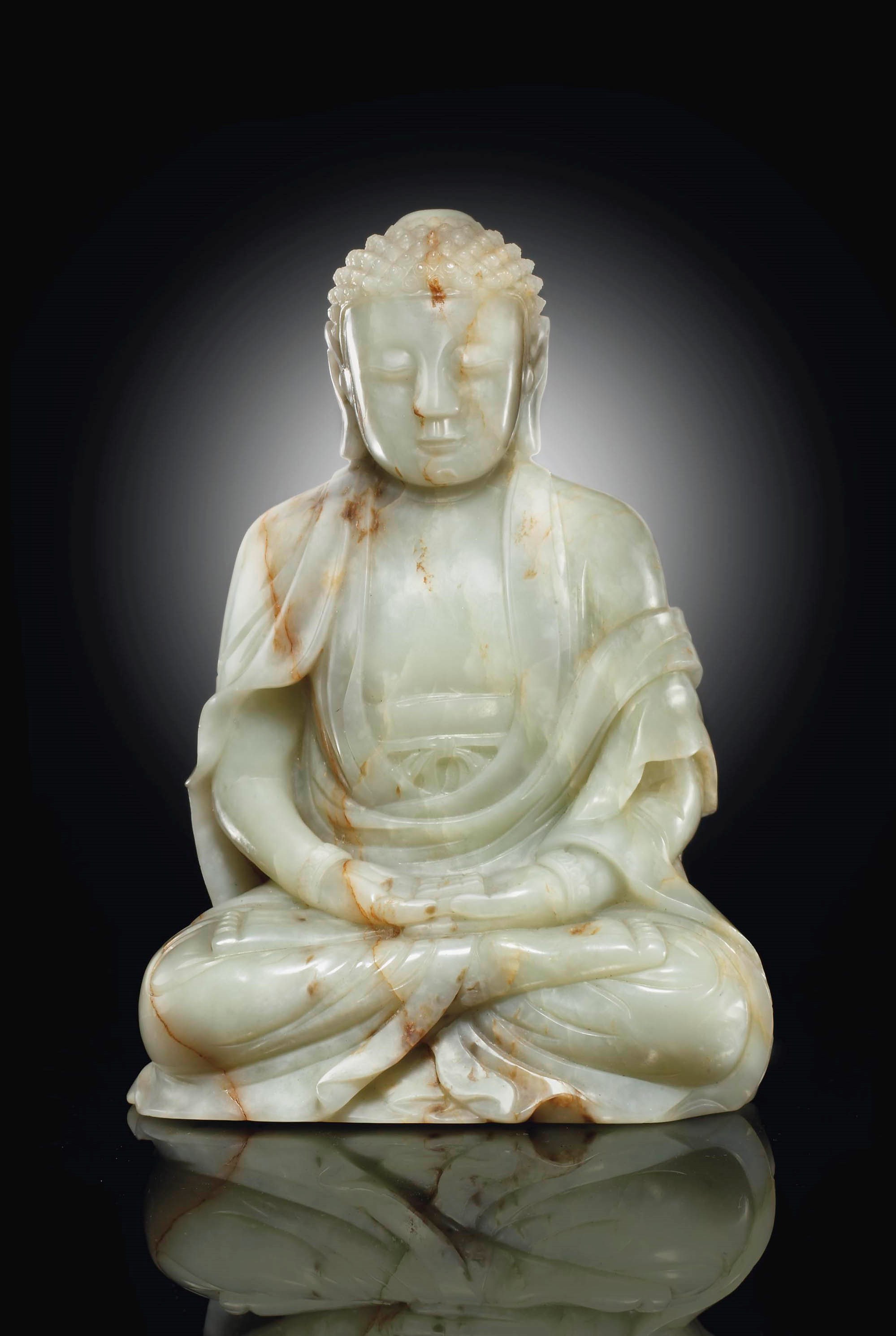 A PALE GREENISH-GREY JADE FIGURE OF BUDDHA